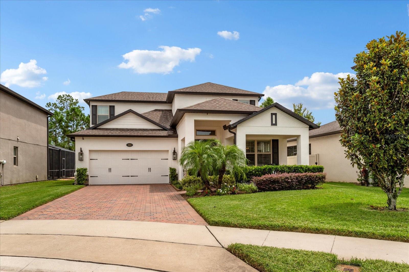 Step into this stunning Sanford retreat where thoughtful design meets modern convenience. Boasting 4 bedrooms, 2.5 bathrooms, and a spacious loft, this 3042 sq ft home on a private cul-de-sac, offers a perfect balance of open spaces and private retreats.
Inside, natural light flows through grand ceilings and open living areas, highlighting wood-look tile flooring and custom designer touches throughout. The gourmet kitchen is a showstopper with 42" white wood cabinetry, brushed gold hardware, Waterstone brushed gold pulldown faucet, and quartz countertops paired with a countertop to ceiling herringbone tile backsplash. A GE Monogram range hood, GE Advantium double ovens, and a Samsung Bespoke smart refrigerator bring luxury and function together. Enjoy casual meals at the breakfast nook, counter-height bar, or step into the large walk-in pantry for effortless storage.
The primary suite is a sanctuary featuring a tray ceiling, custom walk-in closets with built-ins, and a spa-like ensuite bathroom with dual vanities, quartz countertops, and a stunning glass walk-in shower lined with marble tile. Upstairs, a large loft offers endless possibilities—media room, playroom, or home office.
The laundry room shines with quartz countertops, soft close cabinets and a convenient folding station, making everyday tasks feel indulgent.
Additional custom upgrades include designer light fixtures, wrought iron balusters, stained treads with painted risers, plantation shutters, and rich woodwork with wainscoting and shiplap accents.
Step outside to a brick paver lanai overlooking a peaceful water view with no rear neighbors—the perfect backdrop for morning coffee or evening gatherings.
Located just minutes to major highways (3–7 minutes to 417 or I-4), 4.5 miles to Sanford Airport, and 28 miles to Orlando International Airport, this home offers convenience without compromise. Enjoy nearby shopping and dining at Colonial Town Center and Historic Downtown Sanford, only 5 miles away.
With an HOA of $238/month covering lawn care, neighborhood maintenance, and irrigation, this gated community delivers a low-maintenance lifestyle. Zoned for top-rated Seminole County schools, this home blends luxury, location, and livability.