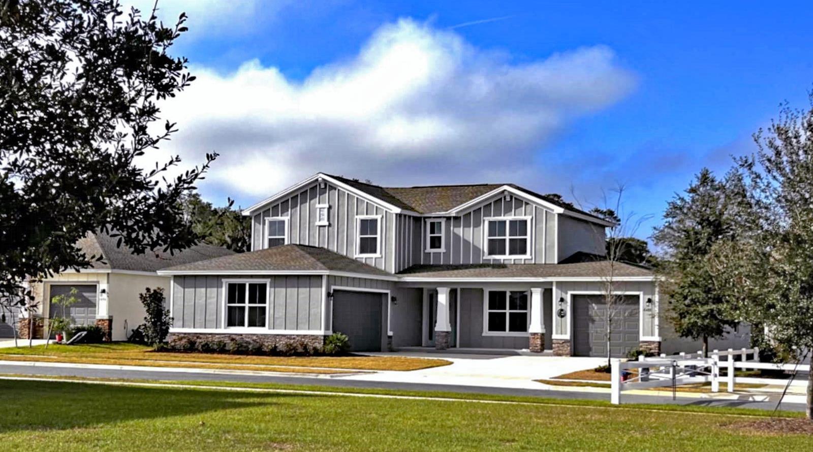This UPGRADED Mulberry model, is located on a PREMIUM LOT in the gated community of Calesa Township. The Mulberry is the largest model, offered with 4 bedrooms, 4.5 bathrooms, 3-car garage, huge loft, and office/flex. The foyer opens to the living room that has a 12’ quad sliding door with picturesque views. The kitchen has an upgraded GAS range, 42” cabinets, quartz island, and stainless appliances. This home as a DREAM PANTRY adjacent to the nest area cabinets, prep sink, and wine refrigerator. The master bedroom is located downstairs with tray ceilings and two walk-in closets. The master bath has double vanity sinks, a tile shower, and soaking tub. Upstairs is a large loft, two en-suite bedrooms and one bedroom with adjoining bathroom for maximal privacy! There are no homes directly in front of or behind, enjoy spectacular views from the front porch and back lanai. The lanai has natural gas and is plumbed for an outdoor kitchen. Bring your golf cart. Multi-modal paths to the on-site public charter school, and FAST center. There are endless amenities offered at Calesa Township including playgrounds, basketball courts, swimming pools, splash pads, walking trails, dog park, and skate park. Pickleball courts, water slide, adult pool, and Biergarten are currently under construction.