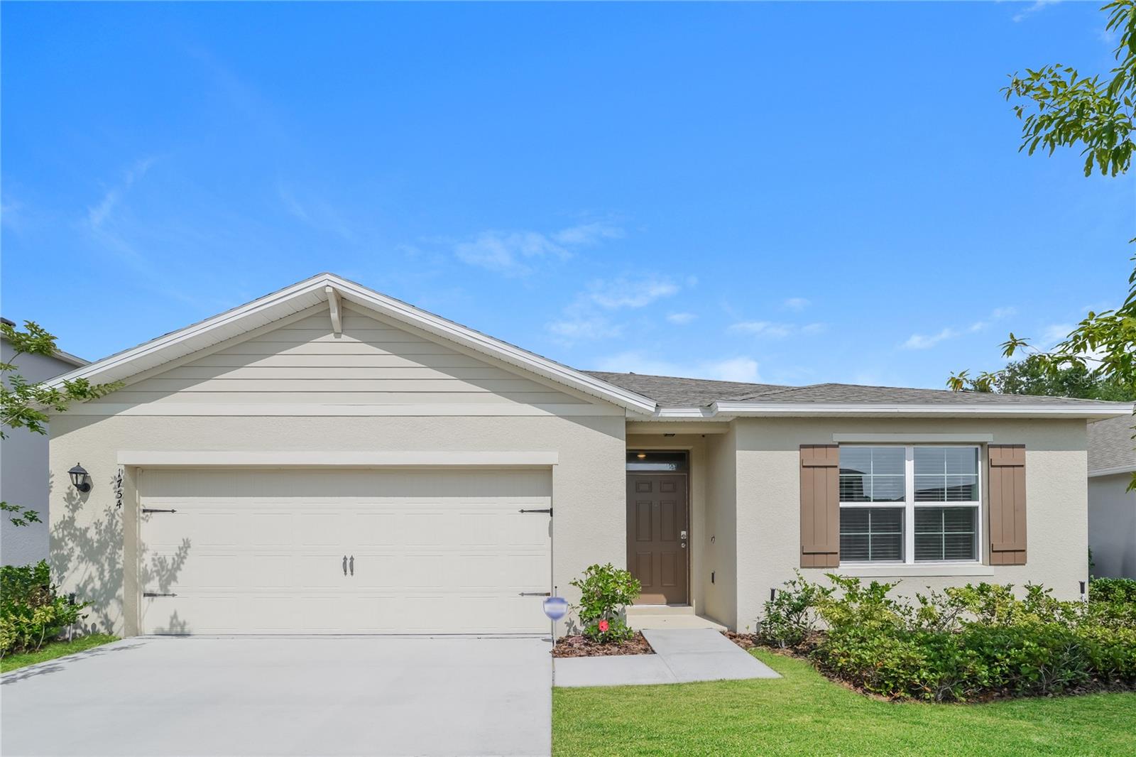 Built in 2019, this beautifully maintained 4-bedroom, 2-bath home offers a bright, open layout with modern finishes throughout. Neutral tones, tile in the main areas, and vinyl flooring in the bedrooms create a warm, inviting feel. The spacious primary suite includes a walk-in shower, double vanity, and ample closet space. Enjoy a generously sized backyard with plenty of room to relax. Conveniently located near schools, shopping, and major roadways, this home is move in ready and shows like new.