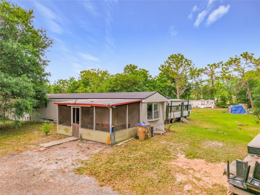 Tucked behind a private gate on one acre, this 2-bedroom, 1-bath manufactured home offers a rare opportunity to enjoy quiet country living with room to spread out. With 784 square feet of living space, the home provides a functional layout and a blank canvas for buyers looking to personalize or invest. The expansive lot delivers privacy, flexibility, and potential—ideal for those seeking space for outdoor living,  storage, or future improvements. Located just a short drive from Melbourne Beach, the property also offers convenient access to local schools, shopping, and major roadways, balancing rural tranquility with everyday accessibility. Whether you're a buyer, investor, or someone looking to create a peaceful retreat, this property presents strong potential at an accessible entry point.