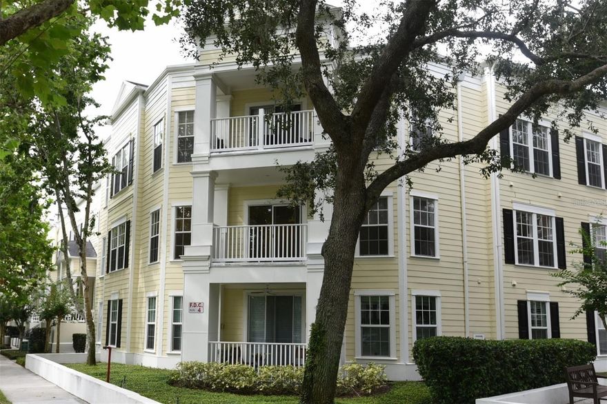 Located in Celebrations Main Village! A 3 Bedroom, 2 Bath unit; the additional large Den/Home Office can serve as the 3rd Bedroom. This rare Corner Unit model has a large Covered Balcony that overlooks the Water Street Canal, with its waterfalls & Cala Lilies & Ducks. The flooring is new carpet and ceramic tile. The Living/Dining Room with Crown Molding offers a Sliding Patio Door to your Covered Private Balcony. The Kitchen has a Pantry and Breakfast Nook with 2 Windows offering great views of a lush green space. A Large Bedroom has a Walk-in Closet plus Bath with Shower/Tub combination. The Laundry Room has a Full Size Washer & Dryer plus additional shelves for Storage. The Owners' En Suite has a walk-in closet plus Bath with Shower/Tub combination, and the second bedroom has two separate mirrored closets with En Suite access to the second bathroom. INVESTOR'S DELIGHT! Current Tenants in a Lease through 2027. Notable Celebration Amenities include: Lakeside Heated Community Pool, Playground, Tennis & Basketball Courts, Golf Course, Library, Miles of Biking/Walking Trails, Restaurants, Sunday Farmer's Market, Advent Health Hospital, Post Office and much MORE! Close to Walt Disney Theme Parks, Resorts and Disney Springs. Be sure to visit the link to the 3D virtual floor plan / tour!