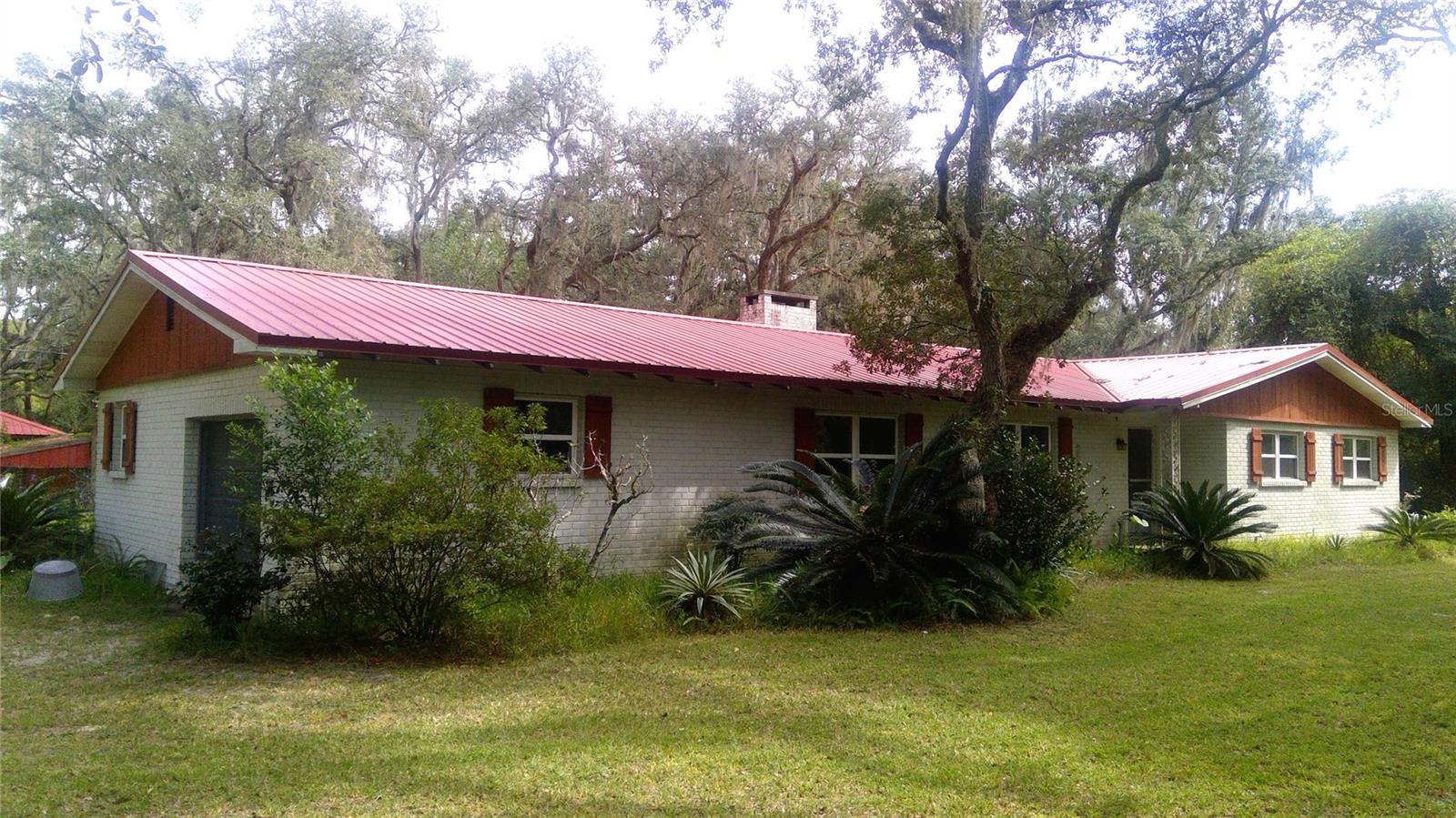 Home on a beautiful 4-acre wooded tract on the Withlacoochee River. Investment opportunity due to flooding after Hurricane Milton. A metal roof was put on in 2020, and there is a whole-house Kohler generator with an inground propane tank. The home is also located right across from the 46-mile Withlacoochee State Trail. An additional 1.69 acres is available for $90,000.