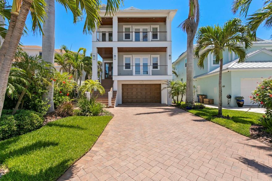 Experience the tranquil elegance of waterfront living in the luxury coastal enclave of Indian Rocks Beach. Just minutes from the Gulf’s white sand shores, this beautifully renovated and elevated Key West–style home is perfectly suited as a full-time residence, a vacation retreat, or a potential investment property. Thoughtfully crafted for daily comfort, waterfront entertaining, and lasting durability, this home showcases three levels of indoor-outdoor living, each enhanced with custom details throughout. From the bespoke cable-railed staircase, a light-filled entry leads to refined living spaces that blend coastal charm with understated sophistication. With 10-foot ceilings and an open flowing floor plan, it offers a formal dining room, open living room and kitchen, with a breakfast bar and eating area. Sliding glass doors lead to a waterfront terrace complete with tongue-and-groove ceiling detail, boasting endless views of the pool, spa, and Intracoastal Waterway. A custom stone feature wall, maple bookshelves, and a sleek electric fireplace anchor the living room.  A custom quartz kitchen accommodates small or large gatherings, featuring Thermador and Samsung appliances, along with a custom tile backsplash. A convenient guest bedroom and full bath are located just off the entry, working well for overnight accommodations or as a private office. Upstairs, the primary suite delivers a waterfront sanctuary, opening to a private terrace through expansive sliding glass doors and boasting a morning wet bar/beverage station, generous walk-in closet, and an opulent bath with refined finishes, glass-enclosed shower, and garden tub. Maple flooring continues throughout two additional bedrooms and a spacious loft. Outdoors, invite you to the covered lanai and saltwater pool/spa, perfectly poised at the water's edge with a large paver pool deck. Discover the best of year-round boating, jet skiing, and wakeboarding in a deep-water location, with a full-service Brazilian IPE dock and 16K lift to accommodate large craft and a newer seawall (2023). Enhanced by a Sonos surround sound system and recessed interior and exterior LED lighting, this thoughtfully designed residence features a wood-paneled 3-stop elevator and an array of high-end appointments, including solid maple interior doors, Pella windows, metal roof (2016), whole-house water filtration and softener system. The oversized 4-car garage includes a workshop and ample storage, ideal for storing pool accessories and water toys. This relaxed coastal community offers a tropical slice of Florida paradise with effortless access to year-round water recreation, natural beauty, and the nearby shores of Clearwater and St. Petersburg. Part of the vibrant Tampa Bay region—named one of America’s Best Places to Live—it provides endless opportunities for outdoor adventure, shopping, dining, cultural attractions, and professional sports. The Flood Insurance policy is only $1,017 per year and is assumable. Available fully furnished at additional cost.