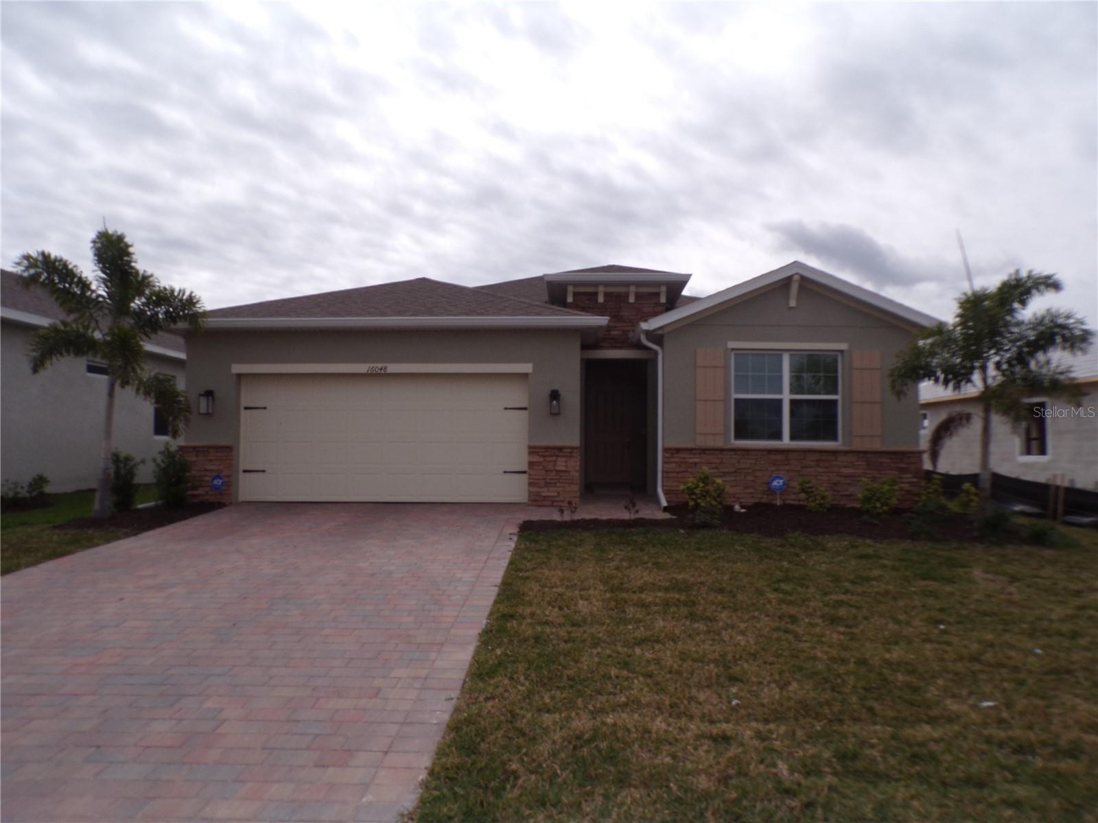 AVAILABLE JANUARY- APRIL 2026 - IMPECCABLY FURNISHED 3 bedroom, 2-bathroom BRAND NEW Home in The Cove of West Port. This Community features Resort Pool, Club House, Pickle Ball, Bocci Ball, Dog Park and Gate. LIGHT AND BRIGHT open-concept floor plan boasts double-sliding glass door and a multitude of windows to fill the kitchen, great room and dining area with the Florida sunshine. The island kitchen is ideally situated in the center of the home, between the dining and great room; perfect for entertaining. AMAZING kitchen with cabinets, counter space and walk-in pantry. Off the living area enjoy the paved and covered lanai. The Master Bedroom features two walk-in closets, dual vanity, a desirable walk-in shower, and a private water closet. Opposite the owner’s suite, at the front of the home, two guest bedrooms share a guest bath. This home also features a bonus room with pull out couch that can be used as office, den, or even a fourth bedroom. A Laundry room and two-car garage complete this home.