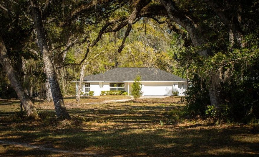 Nearly 46 Acres of Private North Florida Land with Home, Pond & Creek-
If you’ve been looking for space, privacy, and a true connection to the outdoors, this nearly 46-acre property in Old Town offers a rare opportunity to create your own rural retreat. Tucked away down a quiet dirt road, the setting provides a sense of peace that’s hard to find this close to Gainesville.
A canopy of mature oak trees welcomes you in along the driveway, opening up to a mix of open land and natural woods. The property features a scenic pond, a freshwater creek along the back boundary, and an abundance of beautiful old oaks, creating a setting that feels both private and established.
The 3-bedroom, 2-bathroom home has been extensively updated, offering a move-in-ready starting point while still leaving room to make it your own. Improvements include a new roof, water heater, fresh interior and exterior paint, new flooring, a fully renovated hall bathroom, along with updated plumbing and lighting fixtures. A brand-new well pump and water filtration system were just installed. The home includes a two-car garage for added functionality and storage.There is plenty of room to add additional buildings or workshops. 
This property is well-suited for those who value quiet surroundings and outdoor living. With room for gardening, animals, or a full homestead setup, plus opportunities for wildlife watching or hunting, it offers the kind of flexibility that’s getting harder to find.
Located just outside of Gainesville, you’ll have access to town when needed while still enjoying the freedom and privacy of rural North Florida living. Minutes from the Suwannee River and some of Florida's finest fresh water springs.