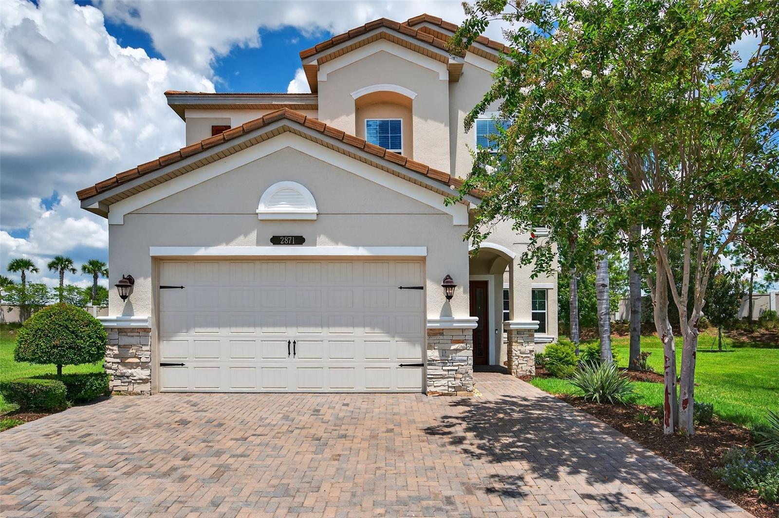 Step inside refined elegance & resort style living in this stunning Conrad floor plan offering 5 bedrooms, 4 bathrooms, plus a spacious loft across 4,222 total square feet of elegant living space, perfectly situated on an OVERSIZED CUL-DE-SAC homesite of OVER a quarter acre in one of Wesley Chapel’s most sought-after resort-style communities. From the moment you arrive, the brick-paved oversized driveway and walkway create a grand entrance and set the tone for the quality within. The first floor showcases tile flooring throughout, a formal living room, formal dining room, and a large family room designed for gatherings. The oversized gourmet kitchen is equipped with upgraded stainless steel appliances, a striking tile feature wall on the center island, abundant cabinetry and counter space, a breakfast nook, and plenty of storage. As part of a natural gas community, the kitchen combines efficiency with culinary excellence. A full bedroom and bathroom on the first floor provide the perfect setup for guests or multi-generational living. Upstairs, luxury vinyl plank flooring flows throughout the living spaces. The primary suite is over 400 square feet and features a double-door entry, two walk-in wardrobe closets, dual vanities, a walk-in shower, and a soaking garden tub. Another bedroom offers its own private bath, while two additional bedrooms share a Jack & Jill bath. The spacious loft offers versatility as a media room, home office, or play area. A screened patio overlooks a generously sized backyard, offering exceptional space to design your own private outdoor retreat, ideal for a custom pool, summer kitchen, or expansive entertaining area. Located in The Ridge at Wiregrass Ranch, residents enjoy a zero entry resort-style pool, separate lap pool, tennis and pickleball courts, an indoor sports court, 24-hour fitness center, and a vibrant clubhouse. All of this is just minutes from top-rated schools, Wiregrass Mall, Orlando Health, The Grove, AdventHealth Center Ice, dining, and exceptional healthcare facilities. This home combines luxurious finishes, a functional floor plan, and a premium location. Schedule your private showing today. Be sure to take the virtual tour & watch the custom walk-through video to experience this home's exceptional lifestyle firsthand!