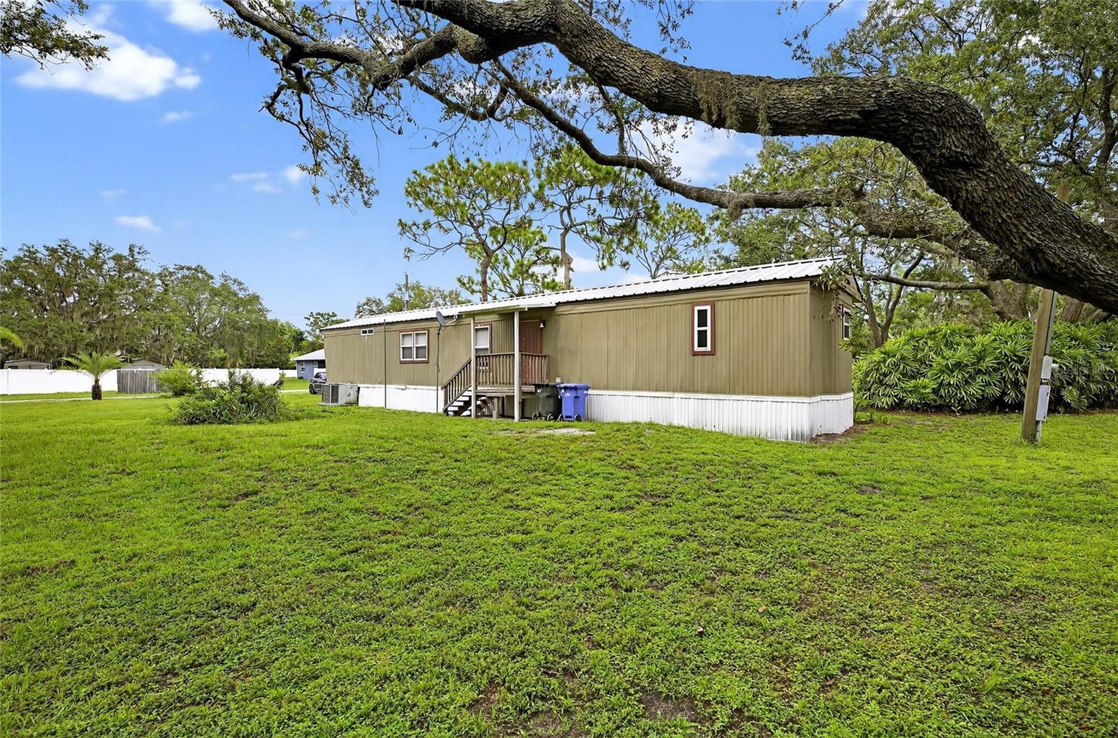 Looking for a house hack? This 2.45 acre property in the heart of Riverview features a 2/2 mobile home and an additional 1/1 unit for extended family or potential income. Property also has fully wired parking pad for RV hookup. Land has one additional garage/outbuilding for additional storage. Both units have leases in place. Sellers are offering owner financing option. Please inquire for details.