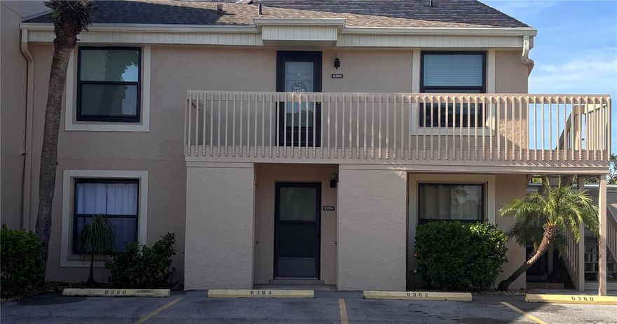 PRICE REDUCTION!! Don't miss this bright and spacious 3 bedroom 2 bath 2nd floor end unit condo with a view of the pool from the balcony. Centrally located just minutes from the beaches of Anna Maria Island and Siesta Key. Located close to stores and restaurants. Hospital is also nearby. Property includes 2 pools, water, sewer, cable, trash!  New roof being installed today 7-10-2025! Beautiful waterproof wood laminate flooring throughout with very pretty barn doors leading to the master bath make this roomy split plan condo easy to maintain and will be an excellent home or rental.. Newer high impact sliding doors to an outdoor carpeted balcony. Front door can be opened to allow more light through a glass storm door. Small storage unit comes with this condo and is located under the unit located to the right of the downstairs unit. This condo is ready for a new owner. Call today for your private tour!