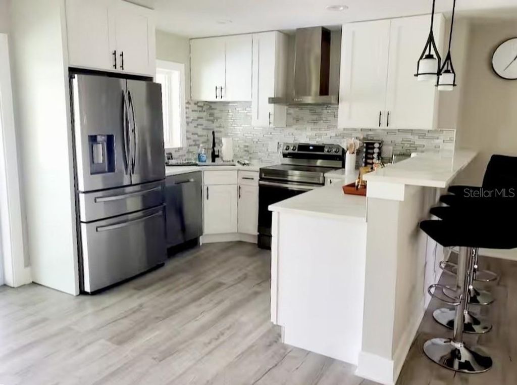 Photo of 1385 Harmony Drive, Port Charlotte, FL 33952 (MLS # TB8496696)