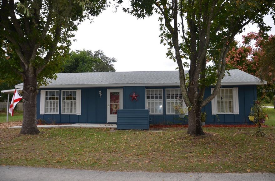 House is snuggled in beautiful, scenic and quant city of Mount Dora and part of the Lake Gertrude Manor.  Short drive to culturally rich historic downtown Mount Dora with wonderful restaurants and lovely shops.  It is situated on a quiet closed street with lake access.
Corner lot with two storage sheds.  One story home with 3 bedrooms and 2 full bathrooms.  New roof and HVAC September 2025 and new carpet in two bedrooms.  New drainfield installed within this past year and tank was cleaned.  Spacious family room which is open to the dining area.   Split bedrooms with two on one side of the house and one on the other side.  Large laundry room separate but conveniently located near the kitchen.  Pre-fab home.  This house offers coziness, convenient location and affordable in one of the most charming cities in Florida.  Don't miss this little gem!