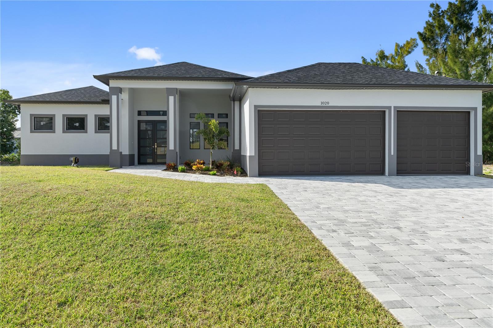 New Construction Waterfront Home with Seawall experience the perfect blend of elegance and functionality with this brand-new custom home, situated on a freshwater canal and complete with an established seawall. This exceptional residence offers 3 spacious bedrooms, 3 modern bathrooms, and a 3-car garage, designed with both luxury and comfort in mind. As you step inside, you'll be welcomed by an open-concept layout with high ceilings and an abundance of natural light, creating a bright and airy atmosphere throughout. The well-designed kitchen seamlessly flows into the living and dining areas, making it perfect for both relaxation and entertaining. The third bathroom is a standout feature, with convenient access to the outdoor area, offering endless possibilities for your future pool. Whether you’re hosting guests or enjoying a peaceful evening, the western exposure promises breathtaking sunsets right in your own backyard. Located in a highly sought-after neighborhood, this home combines luxury living with the practicality of nearby amenities. From the custom finishes to the potential for a private pool, this home offers an unbeatable value for those seeking both style and affordability. Don’t miss your chance to own this waterfront beauty! Schedule a tour today and discover your dream home.