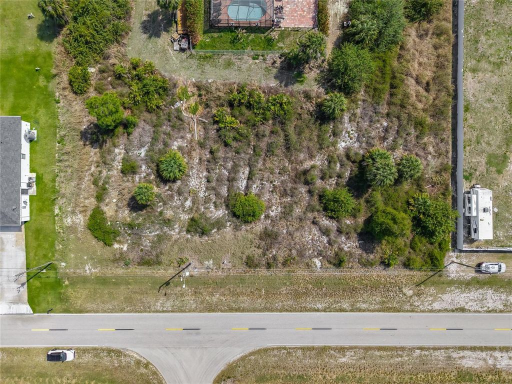 Photo of 750 Nimitz Blvd, Lehigh Acres, FL 33974 (MLS # S5146465)