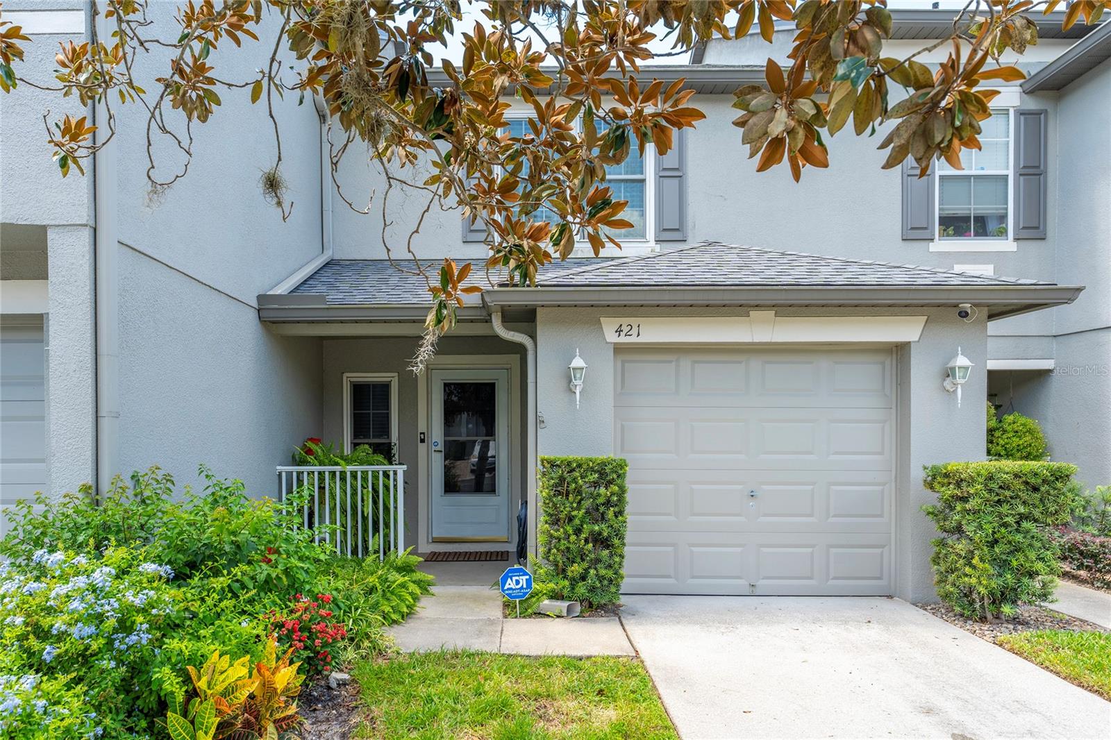 Welcome to 421 Tradition Lane in Winter Springs! This beautiful Town House with 2 bedrooms and 2.5 bathrooms is perfect for those looking for a comfortable and well-located home. There is no carpet anywhere, as the house features wood flooring throughout and ceramic tile in the wet areas, making it easy to clean and maintain. The primary bedroom includes a Walk-In closet with natural light, thanks to a window that lets the sunlight in. The kitchen is fully equipped with all appliances, and the washer and dryer are conveniently located on the second floor. The community is gated, providing extra peace of mind and security for your family. Additionally, it is located in an excellent school district, which includes Layer Elementary, India Trails Middle School, and Winter Springs High School. The location is ideal, being only 20 minutes from UCF (University of Central Florida) and about 30 minutes from Orlando International Airport. It is also close to shops, restaurants, and parks, with easy access to major roads. This Town House is move-in ready and waiting for you to make it your home. Schedule your visit today!