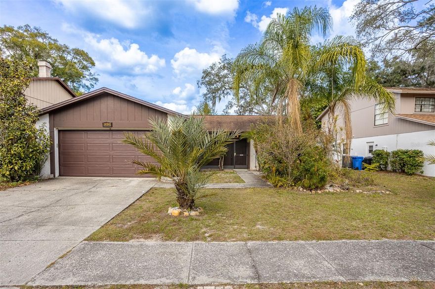 Don't miss this rare opportunity in the highly desirable Lake Forest community of Lutz!  This home features 3 bedrooms, 2 baths, and over 1,500 heated square feet with a spacious 2 car garage with washer/dryer hook ups.  High vaulted ceilings showcase the oversized living room.  Split floor plan features a large primary bedroom with walk-in closet and private bathroom. The Lake Forest community features a low HOA with a pool, tennis and pickleball courts, basketball courts, walking trails, and a clubhouse. With a 2014 roof and 2023 A/C, this home is ready for your final touches!