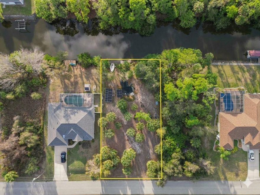 Rare opportunity to secure a waterfront homesite with exceptional flexibility, sailboat access, and development potential in one of Southwest Florida’s fastest growing coastal communities.

The cleared homesite area is outlined with bold boundary lines to clearly illustrate the primary building envelope and usable space of the property, making it easy to envision your future home, investment build, or multi unit development.

This unique lot features a private man made pond that adds character, privacy, and natural beauty to the land while creating a peaceful setting for a future residence or income producing property. The property is equipped with a solar power setup that currently runs the well system, allowing the land to operate off grid for water and electricity when desired.

The waterfront location provides excellent boating capability with a floating dock that includes both power and water hookups. The current owners previously docked a 34 foot catamaran behind the lot, demonstrating the generous canal width and usability of the water access.

From the dock you can navigate through the canal system directly into Charlotte Harbor, one of the largest natural harbors in Florida. From there you have direct boating access to the Gulf of Mexico as well as world renowned boating and fishing destinations including Boca Grande, Gasparilla Island, Cayo Costa State Park, Punta Gorda waterfront restaurants, and numerous barrier islands along the Gulf Coast.

The zoning allows for multi family development which creates outstanding potential for investors, builders, or buyers looking to build a multi generational waterfront property. Opportunities like this are becoming increasingly limited as waterfront parcels continue to be purchased by builders and investors throughout the region.

The location provides convenient access to major transportation corridors including US 41, State Road 776, and Interstate 75, allowing easy travel throughout Southwest Florida.

Nearby schools include Liberty Elementary School, Murdock Middle School, and Port Charlotte High School. Grocery shopping and daily conveniences are just minutes away with Publix Super Market, Walmart Supercenter, and Port Charlotte Town Center nearby. Outdoor recreation can be enjoyed at Port Charlotte Beach Park, Harold Avenue Regional Park Dog Park, and McGuire Park, offering waterfront access, walking trails, and space for pets and outdoor activities.

Medical facilities are close by including HCA Florida Fawcett Hospital and ShorePoint Health Port Charlotte. Travel is convenient with Punta Gorda Airport located approximately twenty minutes away offering direct flights to many major cities, while Southwest Florida International Airport in Fort Myers and Sarasota Bradenton International Airport provide additional travel options.

Whether you envision a private waterfront retreat, a boating lifestyle property, or a strategic investment opportunity, this property offers exceptional versatility in a rapidly growing coastal community. Waterfront land with boating access, existing infrastructure, and flexible zoning is increasingly difficult to find, making this an outstanding opportunity for buyers looking to secure property in Southwest Florida.