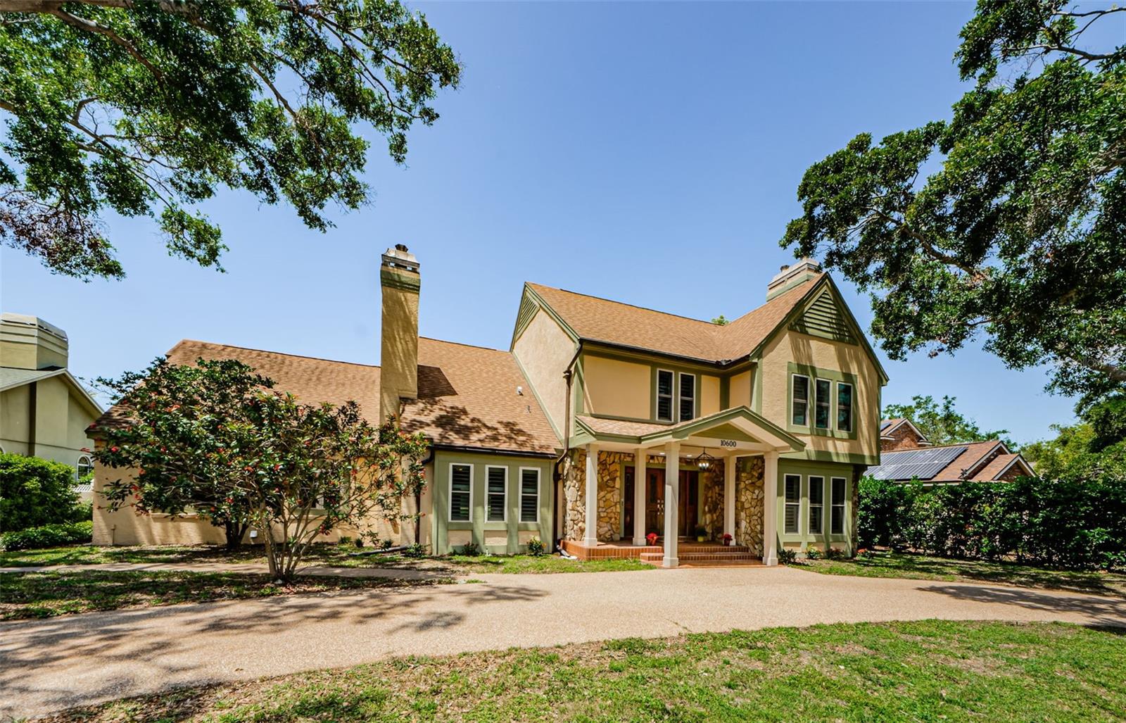 Price enhancement! Bardmoor/Bayou Club neighborhood. This Lovely Tudor home with expansive Bardmoor North golf course views front and back has 4-5 bedrooms and is located on a quiet cul de sac with a newly finished Pebbletec pool and pavers, newer hurricane rated windows, just to name a few updates. No flood zone. This elegant home has a spacious living room with a wood burning fireplace, formal dining room, and a family room with another wood burning fireplace! The garage is at the back of the home with extra parking and turn around space. There is also a half bath off the entry foyer and a gorgeous, updated eat in kitchen which has views of the pool, the pond and the fairways! This spacious kitchen has quartz countertops and newer Bosch and Thermador stainless steel appliances. The Thermador glass cooktop has a stainless steel hood that centers the kitchen island where there is seating for breakfast or a casual glass of wine. As you come in from the garage, you step into the back hallway with a full size laundry room, half bath and an office/yoga room. On the second floor you will find all four spacious bedrooms. The master suite is very well appointed and the master bath has custom cabinets, double sink and vanity, walk in shower and large walk in closet! All windows have plantation shutters over the hurricane rated windows! The upstairs also has an updated hall bath with double sinks and vanities and a modern walk in shower. The big plus is the 4th bedroom and the huge bonus room (or 5th bedroom) which can be whatever you like, currently staged as a game/media room. This desirable country club community has many lovely homes, but they don't have this view and this special street! The large fenced back yard, the course views, plus the sparkling blue pool, and a cozy firepit area that make this a perfect home for entertaining, and with extra parking and turn around in the back adjacent to the garage entrance. So close to so much, yet so much privacy! No storm damage here! The recent updates include: Windows/doors 2024 and 2017, Roof 2017, A/C's 2023 and 2021, pool and decking refinished March 2025, water heater April 2025. Nothing to do here but add your personal touches! Only 20 minutes to the Tampa International Airport and 20 minutes to the beautiful beaches of Clearwater or St. Petersburg! Local shops include, Publix, Starbucks, Panera and many locally owned restaurants! You will love this great Bardmoor/Bayou Club neighborhood! Floor plan attached and in photos!