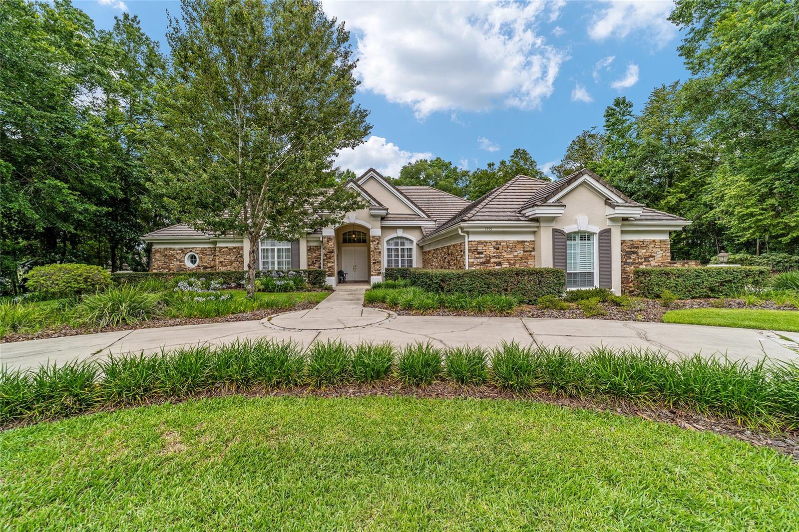 Welcome to this stunning 4 bedroom/3 bath Rutenberg-built home, with 4,614 sq ft of living square footage and situated in a gated golf community with beautiful views of the 18th hole. Step inside to find a well-planned triple split floor plan that includes formal living and dining rooms, a private office, and a spacious bonus/game room with sliders that open out to the pool. Enjoy movie nights in your very own theater room—perfect for entertaining guests or relaxing with family. The heart of the home is the expansive kitchen, featuring abundant cabinetry and a large center island complete with granite countertops. A cozy breakfast room shares double sided fireplace with formal living room and has a mitered glass window overlooking the pool and lanai. The family room, with built-ins also opens to the pool area with sliding glass doors, creating a seamless indoor-outdoor flow. The spacious primary suite has large walk-in closets and a spa-like bath. Bedroom 2 has its own private bath, while Bedrooms 3 and 4 share a convenient Jack and Jill layout. Step outside to your private backyard oasis! The screen-enclosed covered lanai offers a shaded retreat, while the saltwater pool is surrounded by a beautiful pavered deck—perfect for soaking up the sun or entertaining friends and family. Additional features include a spacious laundry room, an attached 3-car garage, and a detached garage for extra storage or hobbies. With its spacious layout and unbeatable golf course views, you won’t want to miss this one!!