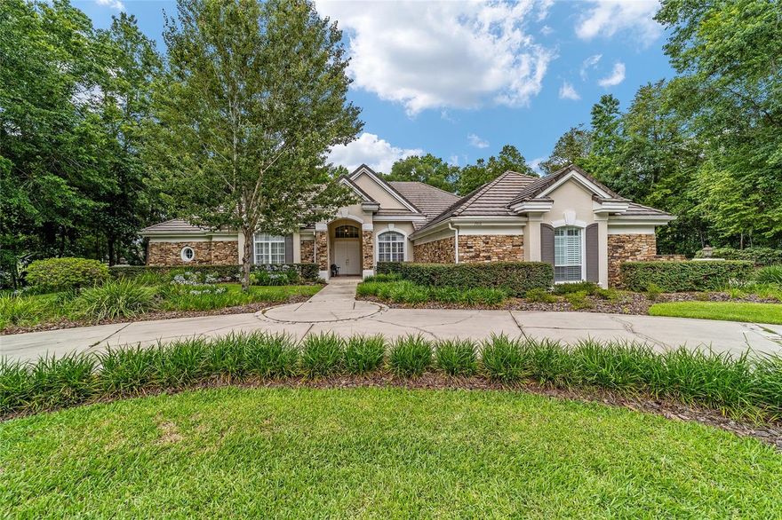 Welcome to this stunning 4 bedroom/3 bath Rutenberg-built home, with 4,614 sq ft of living square footage and situated in a gated golf community with beautiful views of the 18th hole. Step inside to find a well-planned triple split floor plan that includes formal living and dining rooms, a private office, and a spacious bonus/game room with sliders that open out to the pool. Enjoy movie nights in your very own theater room—perfect for entertaining guests or relaxing with family. The heart of the home is the expansive kitchen, featuring abundant cabinetry and a large center island complete with granite countertops. A cozy breakfast room shares double sided fireplace with formal living room and has a mitered glass window overlooking the pool and lanai. The family room, with built-ins also opens to the pool area with sliding glass doors, creating a seamless indoor-outdoor flow. The spacious primary suite has large walk-in closets and a spa-like bath. Bedroom 2 has its own private bath, while Bedrooms 3 and 4 share a convenient Jack and Jill layout. Step outside to your private backyard oasis! The screen-enclosed covered lanai offers a shaded retreat, while the saltwater pool is surrounded by a beautiful pavered deck—perfect for soaking up the sun or entertaining friends and family. Additional features include a spacious laundry room, an attached 3-car garage, and a detached garage for extra storage or hobbies. With its spacious layout and unbeatable golf course views, you won’t want to miss this one!!