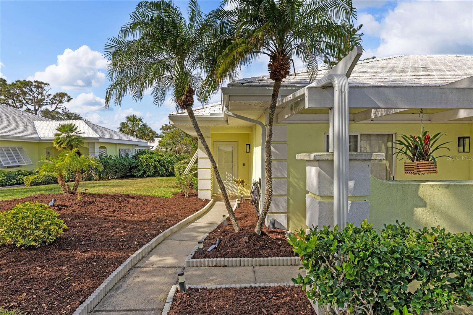 Welcome to Augusta Villas. This meticulously maintained newly renovated 2 bedroom, 2 bathroom villa features an additional bonus room currently used for an office and extra storage that connects the laundry room to the unit. Some of the new upgrades include all new bathroom custom cabinetry and LED lighting, new faucets and sinks. New water heater in 2023. This unit has new tile throughout. NO CARPET!. The bathrooms and the office have new beautiful quartzite tops. Kitchen was renovated in 2021 with custom cabinetry, lighted tray ceiling, granite tops and appliances. Dishwasher replaced in 2022. New HVAC in 2021 with humidity control and wifi controlled thermostat. Light neutral colors throughout make it move in ready. Outdoor you will enjoy a large screened lenai and a bright sunny patio. Fresh new landscaping and a NEW ROOF in October 2024 make this the perfect investment or home for anyone. HOA fees include cable, yard maintenance, and exterior building maintenance including carport and roof. Augusta Villas has a very active and lively social committee with two community pools and clubhouse. Plantation Golf & Country Club are optional for Golf Tennis, Pickleball and Dining.
