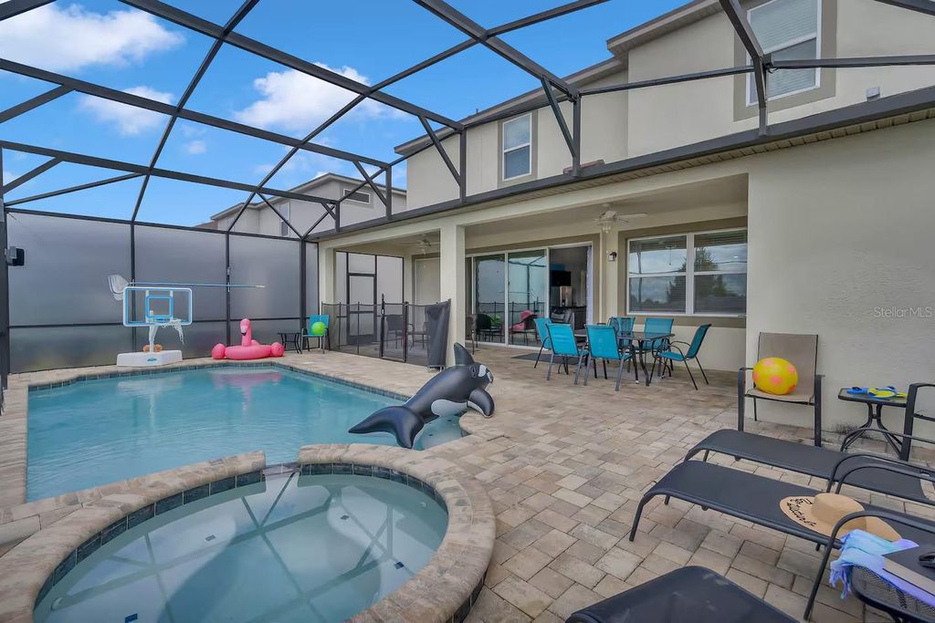Photo of 1568 Nassau Point Trail, Kissimmee, FL 34747 (MLS # O6378553)