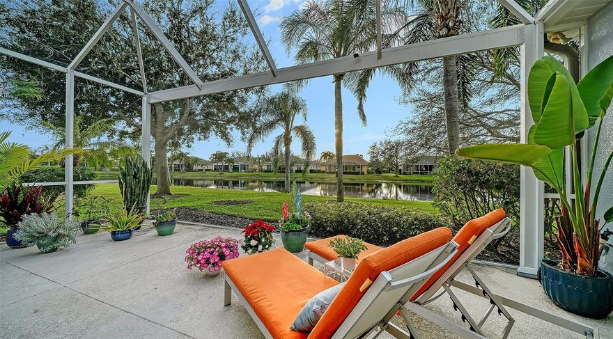 LOCATION, LOCATION, LOCATION!  Beautifully maintained and ideally positioned within the highly sought-after community of Wisteria Park, this exceptional residence offers the perfect blend of elegance, comfort, and Florida lifestyle living. Just minutes from pristine Gulf beaches, premier dining, and upscale shopping, the location is truly second to none.  This spacious three, bed, two bath home plus a versatile den enjoys captivating water views and offers generous space for both everyday living and entertaining. Upon entry, you are welcomed into a bright, open-concept living area highlighted by soaring tray ceilings, crown molding, and an abundance of natural light. A defined dining space thoughtfully frames the tranquil lake views, while the expansive great room features sliding glass doors that seamlessly extend the living space to the outdoors.   The extended lanai is a true showpiece, complete with clear view panoramic screening and coveted western exposure providing front-row seating to Sarasota’s breathtaking sunsets. Designed for elevated outdoor living, this impressive space includes gas and electric connections for a future summer kitchen, electronic awnings for additional shade, and a peaceful setting to relax while enjoying serene water views and Florida wildlife.  The open kitchen is both functional and refined, offering generous cabinetry, expansive work surfaces, a center island with breakfast seating, a closet pantry, and new top-tier appliances including an induction range and a refrigerator which displays your personal photos. A charming breakfast nook overlooks the lake, creating a picturesque start to your day.  The primary suite is a private retreat, featuring hardwood oak flooring, stunning water views, dual walk-in closets, and a spa-inspired bath with dual vanities, a garden tub, and a glass-enclosed walk-in shower. The den, complete with custom built-ins, is currently configured as an office but easily adapts to a fourth bedroom, media room, or creative space. Two additional well-sized guest bedrooms and a guest bath provide comfort and privacy for family and visitors.  Additional highlights include plantation shutters, impact windows, central vacuum, a inside utility room, and an air-conditioned two-car garage with upgraded 20000-lumens lighting.   With low HOA fees, maintenance-free grounds, and a community pool just steps away, this home offers effortless living in a beautifully maintained neighborhood. Whether you are seeking a full-time residence or an elegant seasonal retreat, this property delivers location, lifestyle, and luxury in one remarkable offering.