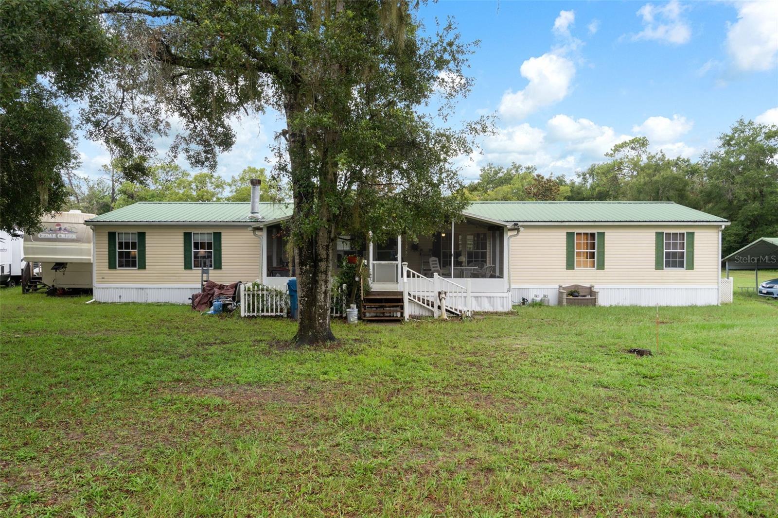 Escape to the Country with Room to Roam! Welcome to your new home in beautiful Brooksville, — a rare opportunity to own a spacious 4-bedroom, 2-bathroom home nestled on 5 acres MOL, zoned AG — so bring your horses and enjoy the freedom of country living with the convenience of being just minutes from restaurants, shopping, and more! This versatile property offers the best of both worlds: peaceful privacy and proximity to town. Inside, you'll find a thoughtfully designed layout featuring a large game room (or formal dining room) perfect for entertaining, and a separate office/flex room ideal for working from home or creating your dream hobby space. The lower acreage features a dedicated water station, perfect for livestock or future farm development. Plus, you can ride to the renowned Croom trail system on scenic backroads — a major magnet for horse lovers and equestrian adventurers. Step outside and enjoy wide open spaces, starry skies, and plenty of room for animals, toys, or future additions. Furnishings are negotiable, offering the option for a move-in-ready experience. Whether you're looking for a retreat, equestrian property, or simply want more space to live and breathe — this is it.