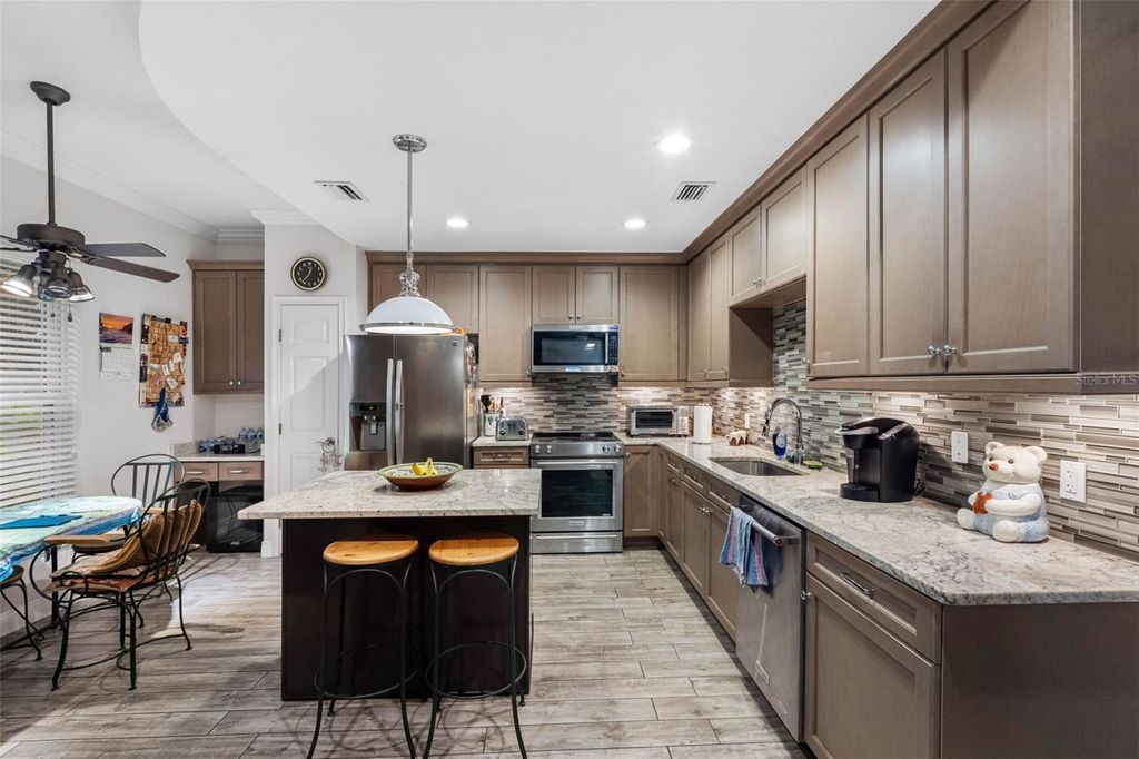 Photo of 763 Date Palm Lane, St Petersburg, FL 33707 (MLS # TB8421610)