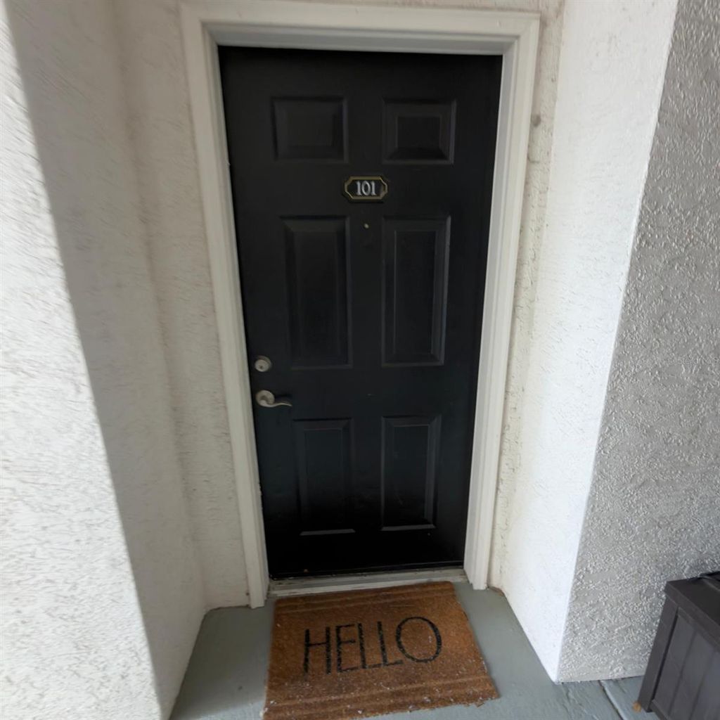 Photo of 12861 Madison Pointe Circle #101, Orlando, FL 32821 (MLS # O6390294)