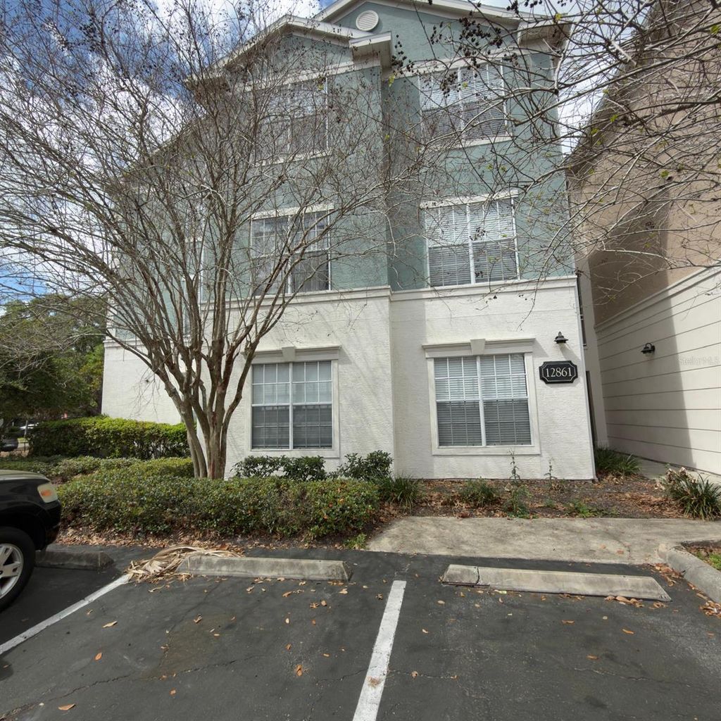 Photo of 12861 Madison Pointe Circle #101, Orlando, FL 32821 (MLS # O6390294)