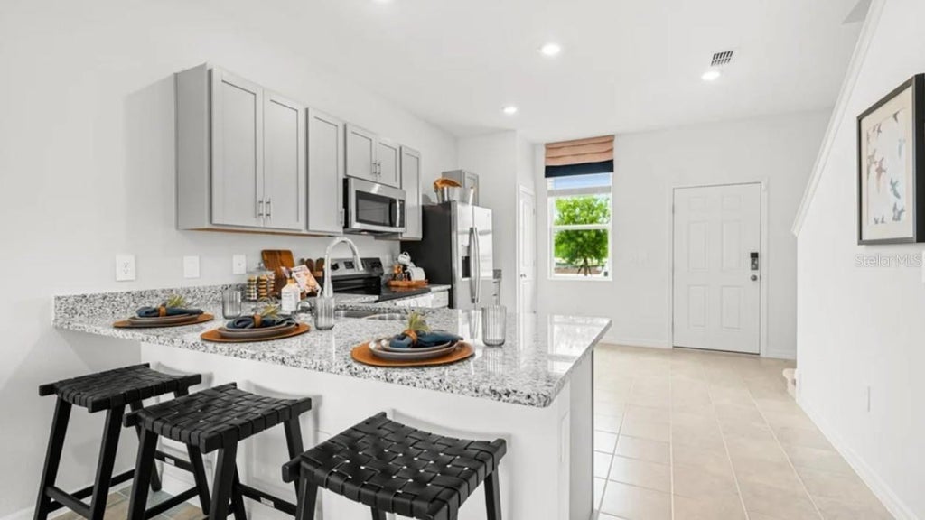 Photo of 713 Ness Island Drive #713, Mount Dora, FL 32757 (MLS # O6450221)