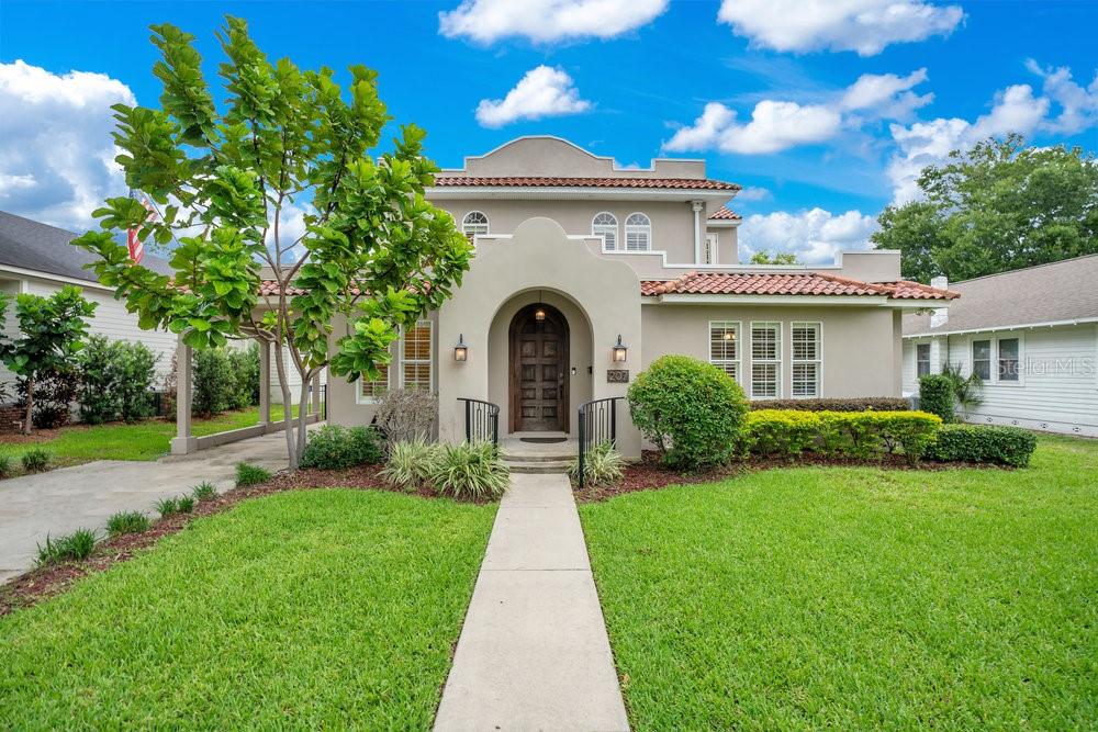 BEACON HILL HISTORIC DISTRICT | SPANISH REVIVAL TREASURE
Welcome to the heart of Lakeland’s beloved Beacon Hill Historic District, where homes rarely come on the market—and this absolutely stunning 1925 Spanish Revival residence is truly a rare find. Thoughtfully and thoroughly renovated while preserving its rich architectural charm, this 100-year-old home blends timeless elegance with the comforts of modern living.
From the moment you step inside, natural light pours into every room, highlighting the original wood floors, custom architectural details, archways, and the beautiful craftsmanship throughout. A grand formal entry, crowned with a skylight, leads to a spacious living room anchored by a classic wood-burning fireplace and a wide, gracefully curved staircase with dual access from the kitchen. The main level offers a formal dining room with a swinging door to the kitchen, a private office, and a cozy family room or den, which includes a closet and can easily serve as a fourth bedroom. There's also a stylish half bath and generous storage throughout.
The kitchen is a dream for both everyday living and entertaining, featuring high-end KitchenAid appliances, a gas range with double ovens, wood cabinetry, quartz countertops, and a fantastic butler’s pantry outfitted with wood counters, custom cabinetry, and a wine and beverage fridge. Plantation shutters enhance the windows throughout most of the home, offering both style and functionality.
Upstairs, the expansive primary suite offers a peaceful retreat, complete with a walk-in closet with wood shelving, an additional closet, and a luxurious ensuite bathroom. The bath features two vanities, a walk-in shower, a jetted soaking tub, and a private water closet with a bidet. Two more spacious bedrooms share an updated hallway bathroom with tile finishes, conveniently connected to a well-appointed laundry room with custom cabinets. A washer and dryer are included.
The charm continues outside, where you’ll find a newly installed saltwater pool with a beach entry and a beautifully finished epoxy-coated back patio perfect for relaxing or entertaining. The detached two-car garage has been completely renovated with cellulose-insulated walls and roof, epoxy flooring, and a powerful mini split AC system, making it ideal for a workshop or studio.
Additional features include a Navien tankless gas water heater, sump pump, gas line for an outdoor grill, crown molding throughout, and a small basement offering extra storage. The roof and HVAC system are approximately 7 years old. The Dining Room Furnishings are available for optional purchase, as it fits perfectly in the space.
This home is a one-of-a-kind opportunity to own a piece of Lakeland history in one of its most cherished neighborhoods. With unmatched character, modern upgrades, and an unbeatable location, this Spanish Revival beauty is ready to welcome its next chapter.