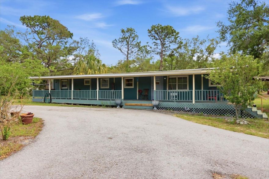 BUY YOURSELF SOME BOOTS AND FADED JEANS AND GO AWAY TO THIS 2BED/1.5BATH MOBILE HOME ON APPROX 2.5 ACRES IN WEEKI WACHEE! Escape the hustle and bustle and kick back on this beautiful property in the heart of Florida's Nature Coast. Loads of potential with the existing home, or live in it while you build your custom dream home! As it sits, you have a 2 bedroom/1.5 bath 1971 mobile with additions. A true primary suite with bathroom attached, with double vanity and updated shower. Guest bedroom complete with the 1/2 bath. Huge front and back porch for overlooking your property and enjoying those Florida breezes. Slip over to the outdoor fireplace for some country cookin' and relaxation! A variety of fruit trees on the property...it is Florida, after all! Outbuildings include laundry, workshop (16x16 approx), and storage (12x12 approx). Several "lean-to" for covered storage or parking. Fully fenced with 3 gates. Above-Ground pool will stay. Flood zone X, so high and dry! Zoned for Winding Waters (K-8) and Weeki Wachee High Schools. Conveniently located to all of the Nature Coast and Bay Area! Access shopping, medical, amusement, and some of the best fishing in the SE United States.