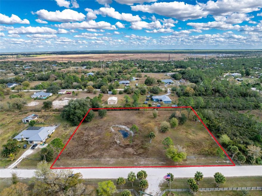 Beautiful 2.5 acres in Charlotte Ranchettes. Property is fenced in and has been cleared, along with some fill dirt. Property is just waiting for you to build your dream home with views of existing pond on the property. Bring your agricultural endeavors! Centrally located to EVERYTHING...US-41, I-75, schools,  restaurants, grocery, retail shopping and best of all....stunning gulf beaches, world class fishing, boating, and a multitude of golf courses!
