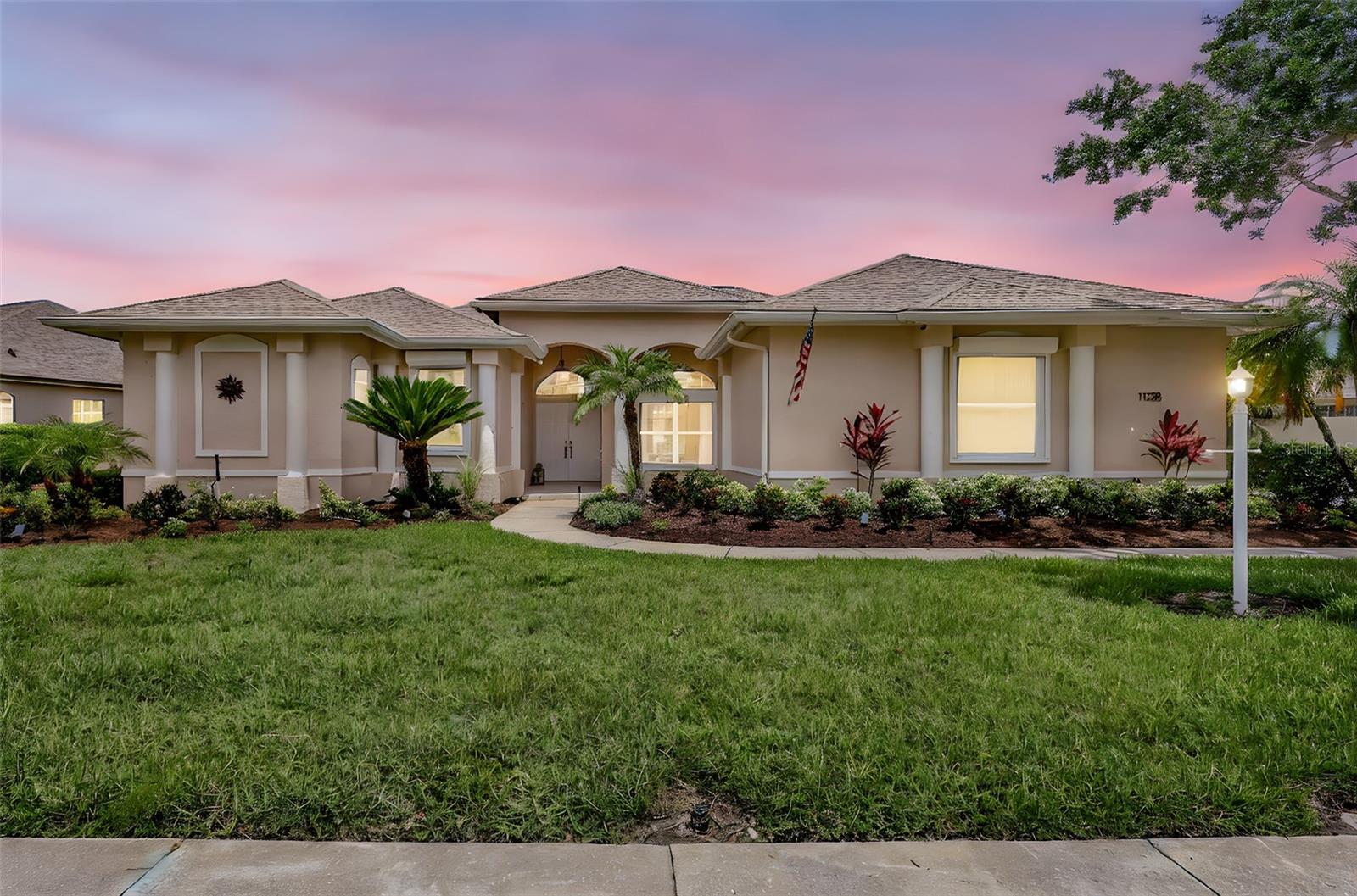 One or more photo(s) has been virtually staged. Welcome to this stunningly updated four-bedroom, three-bathroom, plus a den, home in the highly sought-after and heart of Lakewood Ranch, Summerfield Village. This home blends comfort and elegance in an ideal setting with pool/spa and breathtaking views thru full cage screen of the tranquil lake. From the moment you step inside, you'll be captivated by the elegant new luxury vinyl floors thru out the entire house and abundant natural light. Sliding glass doors connect the spacious living area into the screened-in lanai and pool, providing the perfect space to grill out, relax and enjoy the serene surroundings. The lanai features a clear-view screen enclosure, offering unobstructed views of the lovely large pond and lush landscape. The beautifully renovated kitchen is designed for both style and functionality, featuring solid wood cabinetry, quartz countertops, a stylish tile backsplash, and stainless-steel appliances. The eat-in area provides a cozy and inviting space for casual dining. Designed with a thoughtful split floor plan, this home ensures privacy with three distinct living areas. The primary suite is a true retreat, offering lanai access, two walk-in closets, and an elegant en-suite bathroom with dual vanities, a garden tub, and a separate tile shower. On the opposite side of the home, the second and third bedrooms are conveniently located next to a full bathroom, the fourth bedroom and bathroom with direct lanai access and use as the pool bath. This home offers a formal dining area, a generous living room, and a dedicated office/den. The laundry room is conveniently located off the garage entrance for easy access. Solar panels make it ideal for low electricity consumption. The home is situated on the far side of the neighborhood circle with no through traffic, this home offers a peaceful retreat for the owner. Summerfield Village features miles of walking trails, a park with tennis and basketball courts, a playground, soccer fields, beach volleyball, and a spacious pavilion. Just minutes from I-75, equally between St. Pete and Sarasota with Anna Maria Island your direct beach. Bradenton and one hour north, Tampa, local medical facilities, top-rated schools, Main Street, UTC Mall, fine dining, and the other world-famous beaches, this home embodies the best of Florida living.