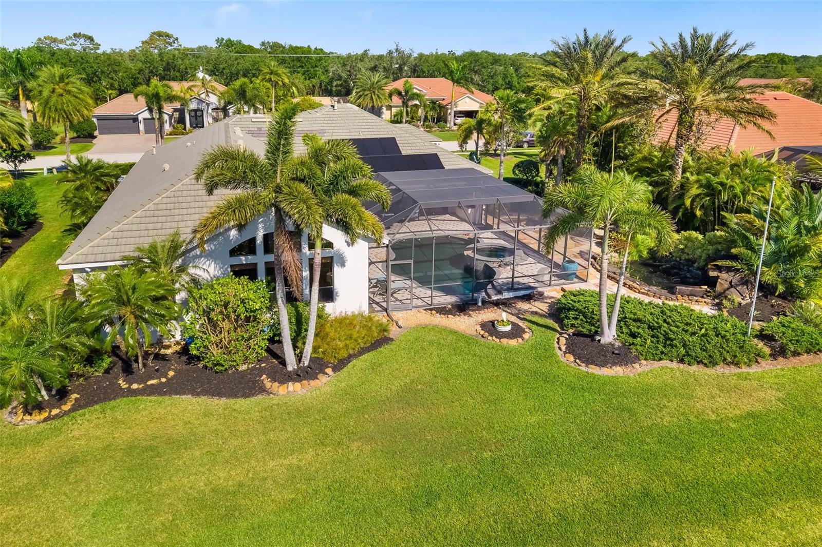 Greyhawk Landing home, 356 Blackbird CT, Bradenton, FL 34212, is built for peace of mind and energy efficiency. Whole-house GENERATOR, SOLAR PANELS, WELL FOR IRRIGATION, in prime Florida location, located in gated community within Lakewood Ranch. Exceptional, spacious custom-designed 4-bedroom, potential for 5 bedroom, 3-bathroom residence with over 3,000 sq ft of living space offers flexibility for multigenerational families, including a bonus room, private office/den on one floor. Situated on a quiet cul-de-sac with peaceful water and nature preserve view is comfortable, elegant, and functional for the busy lifestyle. From the moment you enter the grand foyer with modern lighting and architectural details, luxury vinyl plank flooring throughout no carpet, arched entryways, crown molding, and double tray ceilings, is spacious and designed for everyday living and entertaining. At the heart of the home is the chef’s entertainer’s kitchen, featuring: Custom wood cabinetry with pull-out drawers, marble backsplash, under-cabinet lighting, granite countertops and breakfast bar, high-end gas stove. The open-concept great room offers a cozy fireplace and transitions seamlessly into the formal dining area, perfect for hosting holidays and celebrations. The private owner’s suite is a relaxing escape with dual custom walk-in closets, spa-inspired ensuite bath with soaking tub, walk-in shower with dual showerheads, and separate vanities, direct access to the lanai for morning coffee or quiet evenings. Step outside to your resort-style outdoor oasis, featuring, massive, screened lanai with electronic sunshade, outdoor kitchen with Wolf grill, outdoor shower, and paneled ceiling, heated gas saltwater pool and spa, lush tropical landscaping, walking garden path, tranquil rock waterfall, fire pit area, and a peaceful goldfish pond. Residents of Grayhawk Landing have access to exceptional community amenities, $75 a year HOA: 24-Hour Gated Community, fencing is allowed, Social Events/Clubs, Fitness Facility, GYM, Tennis, Pickleball, Basketball Courts, Playgrounds, Fishing Pier, Baseball, Soccer Fields, Five-mile Biking and Walking Path, Two-Community Centers with Lagoon-style Pool, Spas. Situated in the heart of Sarasota/Bradenton, proximity to world-renowned Siesta Key Beach, Anna Maria Island and Longboat Key, premier shopping and dining, at UTC Mall and St. Armand’s Circle, top rated golf courses, boating, tennis, pickleball facilities. This home offers everything to grow, thrive, and create lasting memories. Start living your best Florida life on the Gulf Coast of Florida in Paradise. Schedule your private showing today 356 Blackbird CT and discover why Greyhawk Landing is the place to be.