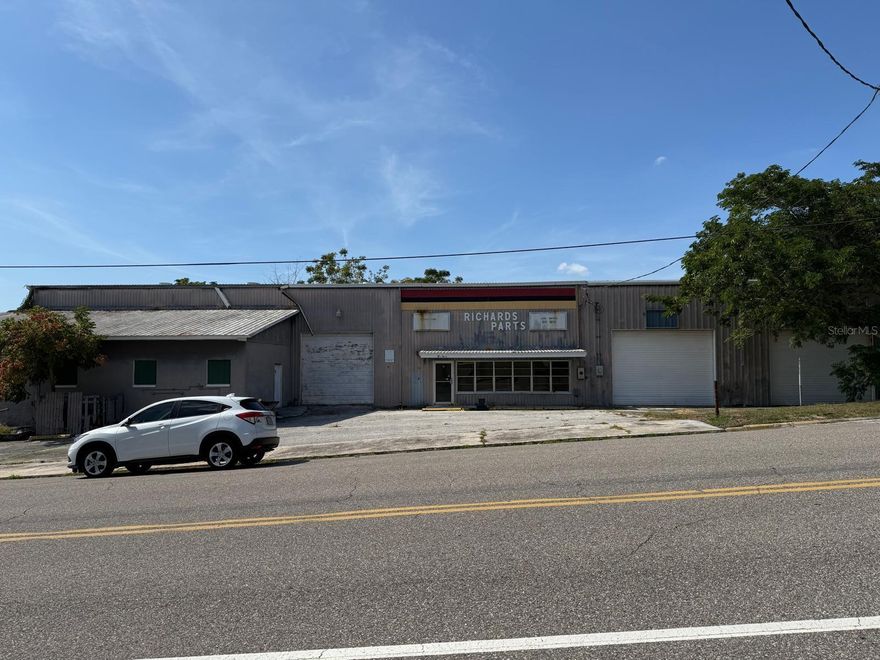 Downtown Haines City opportunity! Two platted lots totaling ±0.46 AC with ±200’ of frontage along N 8th St. The ±8,200 SF mixed-use building (formerly auto parts & repair) offers a flexible layout: 3 front overhead doors, loft storage over a portion of the garage, exterior water tanks, street parking + on-site lot. Visibility, access, and depth make this site a strong candidate for a variety of commercial uses (buyer to verify zoning/approvals). Bring your vision—showings by appointment. Sell “as-is.”