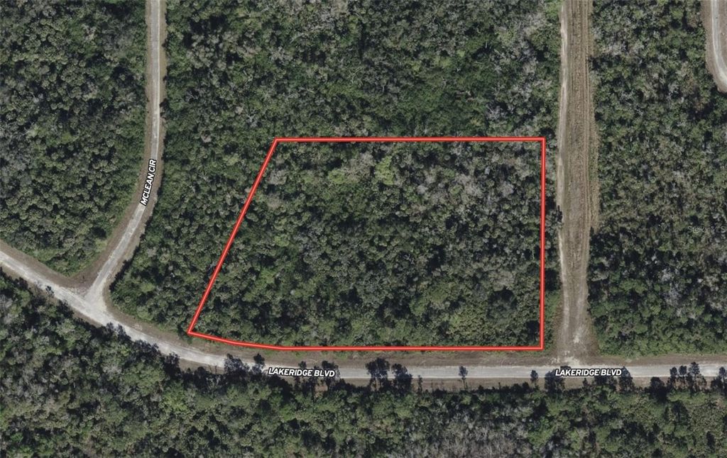 Photo of 520 Lakeridge Boulevard, Lehigh Acres, FL 33972 (MLS # TB8434388)