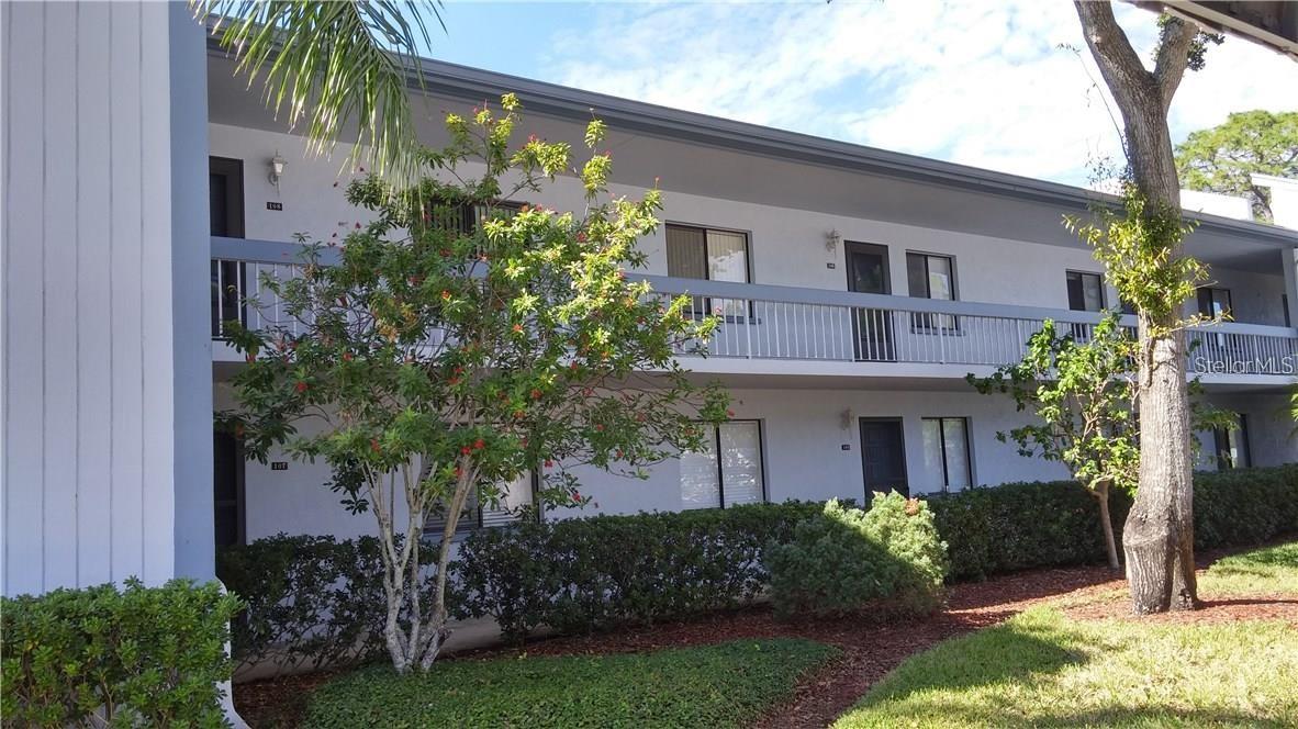Located in East Lake Woodlands, the popular golf course community, this two-bedroom, two-bath condo was totally updated in 2017 with flooring, A/C, hurricane shutters on balcony, stainless look appliances, refrigerated wine rack, additional kitchen storage besides custom pantry with pull out drawers, and granite counters with tile backsplash. New hot water heater was installed in 2020 and so was the new roof fully funded by HOA. Screened balcony has a courtyard style rear view and a nice side view of included community pool. Master Bedroom has 2 walk-in closets and a private bath with shower. Securely gated East Lake Woodlands offers a beautiful lifestyle with lakes, ponds, trees, walkways for fitness and many other community amenities. Optionally, you may join the Country Club for golf, restaurant, drinks, outdoor fire pits, tennis, heated community pools and so many other social activities. Centrally located between Pinellas, Pasco, and Hillsborough counties, a 5-minute walk to Publix, Walmart, Target, and AMC Plaza, and 20-25 minutes to both airports, the location provides easy access to parks, restaurants, beaches and other entertainment venues.