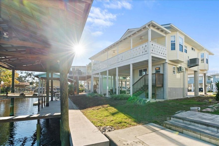 Waterfront Living Meets Modern Comfort! Welcome to your immaculate coastal retreat including two boat lifts allowing easy access to both the Suwannee River and the Gulf — a true paradise for fishing, boating, and soaking in the laid-back Florida lifestyle. Step inside this beautifully updated 2-bedroom, 2-bathroom home, where modern touches and practical upgrades shine throughout. In addition, enjoy a separate 1-bedroom, 1-bathroom suite with its own private entrance — perfect for guests, in-laws, or rental potential. Experience peace of mind with a newer A/C and water heater, new gutters, and a freshly painted interior filled with natural light that creates a bright and inviting atmosphere. The kitchen features a brand-new backsplash, adding just the right amount of style and charm. Updated light fixtures, window treatments, and worry-free luxury laminate flooring flow seamlessly from room to room, enhancing the home’s cohesive appeal. The en-suite bathroom has been completely remodeled, giving you the opportunity to personalize the space to your taste. Enjoy the flexibility of no HOA, giving you the freedom to live the way you want. Outside, you’ll find yourself surrounded by natural beauty and abundant wildlife, where nature and animals share the same peaceful space with a close-knit community of welcoming neighbors. This home is immaculate, move-in ready, and available fully furnished for those seeking a turnkey coastal getaway. Selling As-Is — Schedule your private showing today and discover the charm of Suwannee living!