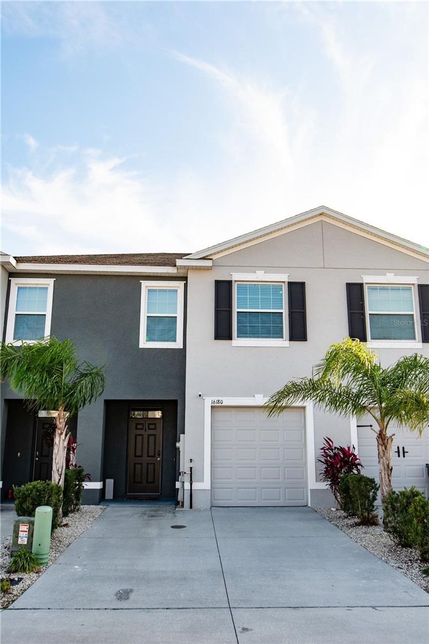 Welcome to this adorable, like-new townhome built in 2021, offering modern upscale and resort style living in the heart of Odessa. This 3-bedroom, 2.5-bathroom home features an open-concept layout with spacious living and dining areas, a convenient half bath, and a charming foyer downstairs. The kitchen is a true standout, boasting stainless steel appliances, wood cabinetry, granite countertops, a tiled backsplash, and large pantry. Sliding glass door leads to the patio for outdoor relaxation.