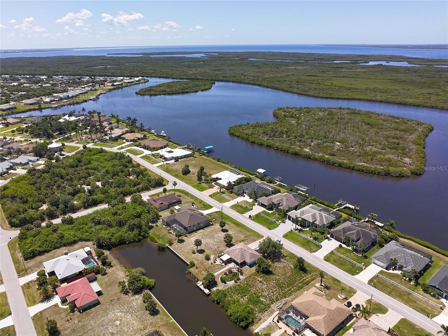 17360 Ohara Dr. Port Charlotte, FL 33948 — WATERFRONT lot offering Gulf access in one of Port Charlotte’s desirable boating communities. This premium canal-front property features 80 feet of waterfront with quick passage to Charlotte Harbor and the Gulf of Mexico, creating the ideal setting for coastal residence. Surrounded by upscale custom-built homes, this buildable lot delivers scenic water views and sought-after lifestyle for boating, fishing, and waterfront living. Public water and sewer are available, and there is NO HOA, providing flexibility for your future home design. Prime location near marinas, waterfront dining, shopping, golf courses, and Gulf beaches. A rare opportunity, secure your piece of paradise today!