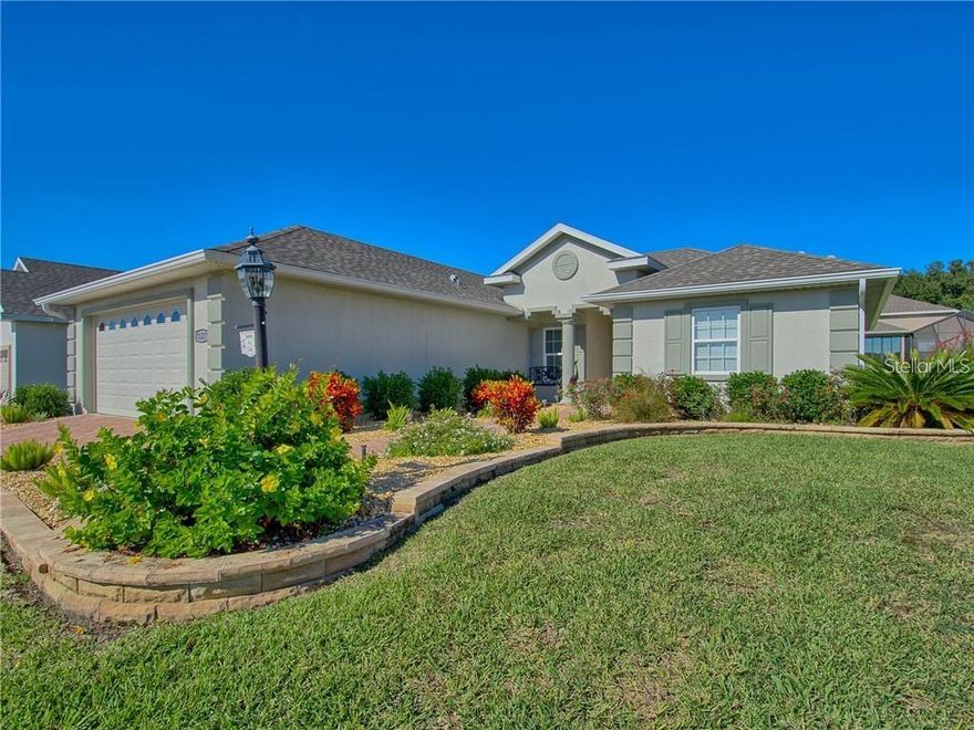 Welcome to this beautifully upgraded Sycamore model located in the highly desirable 55+ golf course community of Stonecrest. With private roads and secure gated access, this vibrant neighborhood offers resort-style living in a peaceful, well-maintained setting. This 3/2 offers 1,472 square feet of thoughtfully designed living space with quality upgrades throughout. Inside, the home showcases upgraded flooring, granite countertops, ceiling fans, and a new storm door for added comfort and efficiency, while a solar tube brightens the laundry room with natural light. The spacious primary suite features a completely renovated walk-in shower and new flooring, offering a modern, spa-like retreat. One of the standout features of this home is the enclosed lanai, complete with heat and air, glass windows with screens, tile flooring, and solar shades—providing a comfortable year-round space to relax or entertain. The garage has been expanded by three feet in length, offering extra room for storage or larger vehicles, and includes convenient attic pull-down stairs for additional storage access. This move-in-ready home, is offered turnkey with an electric golf as well. Enjoy golf, security, and the lifestyle you’ve been waiting for — all in beautiful Stonecrest.