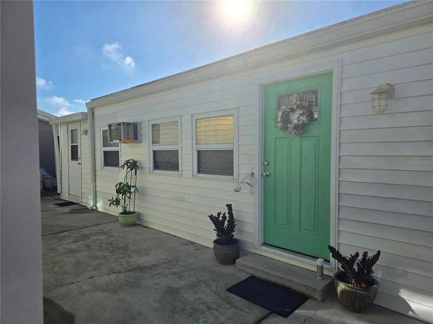 Escape to the heart of Englewood and discover the perfect winter retreat. Located close to restaurants, beaches, golf courses, grocery stores and more. This 1+ bedroom, 1 bathroom cozy living space in being sold turnkey. There's updated plank flooring throughout, new kitchen cabinets with beautiful butcher block counter tops, propane stove and A/C updated in 2018. HOA Fees are only $140 monthly and that includes water, sewer lawn maintenance and all amenities and you own the land. Holiday Travel park is a 55+ gated community with so many must-see amenities. Engage in friendly competition on the bocce ball and horseshoe courts or enjoy leisurely moments on the shuffleboard court. The spacious recreation center offers a pool table, an indoor pickleball court, and a variety of card games. Optional boat or RV storage is available on a rental basis. Embrace in a slice of paradise in this delightful property, perfect for a cozy winter escape or peaceful retirement. Holiday Travel Park offers an exceptional lifestyle. Don't miss out on this opportunity to make the charming retreat your own. Your dream of owning a winter getaway awaits.