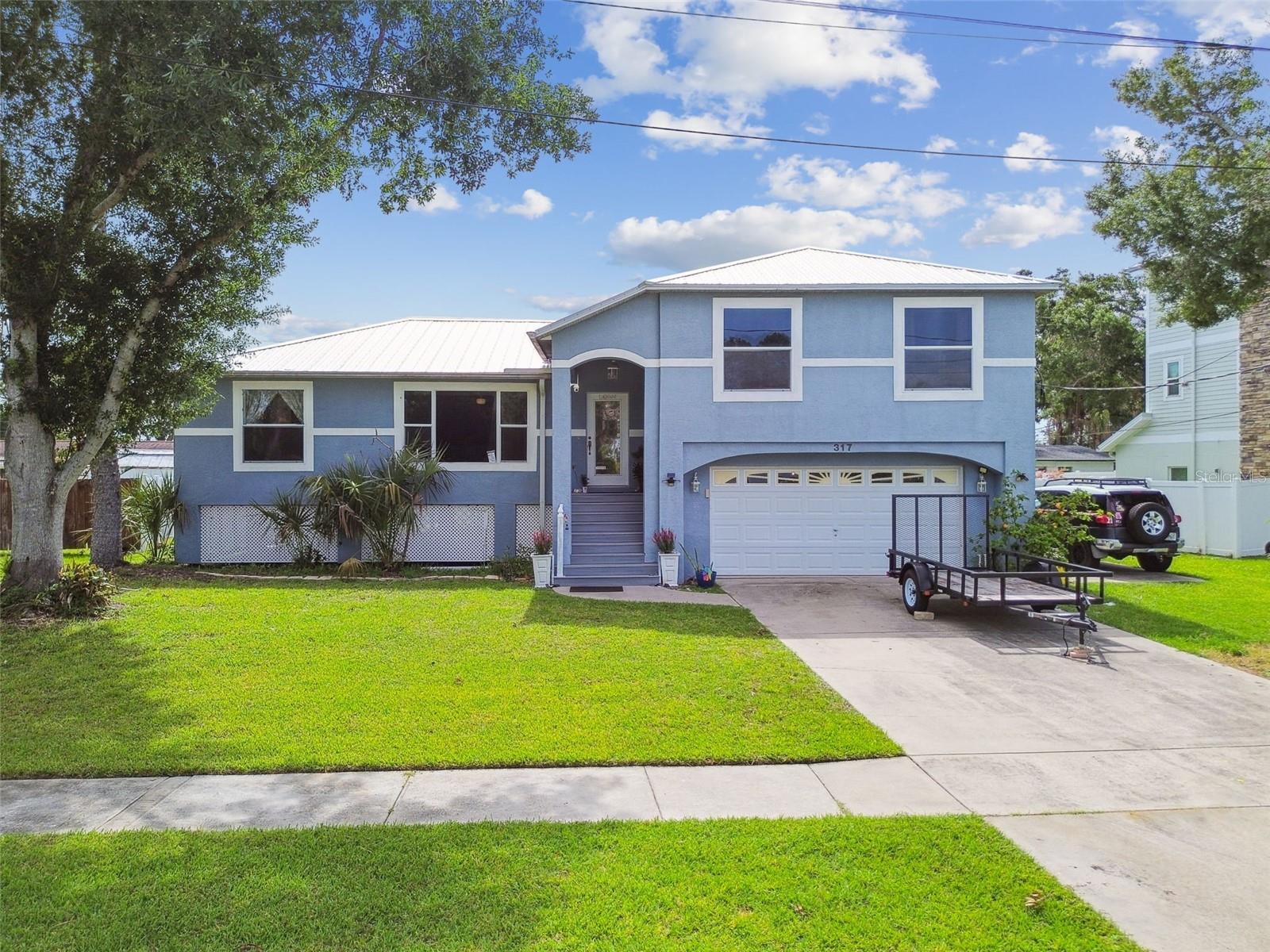 Stunning Tampa Bay Views in Prime Oldsmar Location – Updated & Move-In Ready!
Enjoy breathtaking views of Tampa Bay from this elevated single-family home, perfectly situated in one of Oldsmar’s most desirable neighborhoods. Just steps from waterfront parks and nature trails, this 3-bedroom, 2-bath split-level home offers the ideal combination of comfort, location, and peace of mind.
The home features a brand-new roof, and the elevated design means only the spacious 2-car garage is on the ground level—offering added safety and durability. Inside, enjoy stylish upgrades including quartz countertops, a fully renovated primary bathroom with walk-in closet, and an updated water heater—all within the last five years.
Out back, you’ll find a fully fenced, level yard, perfect for entertaining on the patio or relaxing in the screened-in porch. There's even a dedicated RV or boat pad—a rare bonus in this area.
Within walking distance, enjoy a vibrant outdoor lifestyle with access to pickleball courts, a dog park, tennis courts, fishing pier, playgrounds, and more—all nestled along the scenic waterfront. Located in a top-rated school district, this home is a true gem for families, outdoor enthusiasts, and anyone seeking the best of Florida living.
Don’t miss this opportunity—schedule your private showing today!
