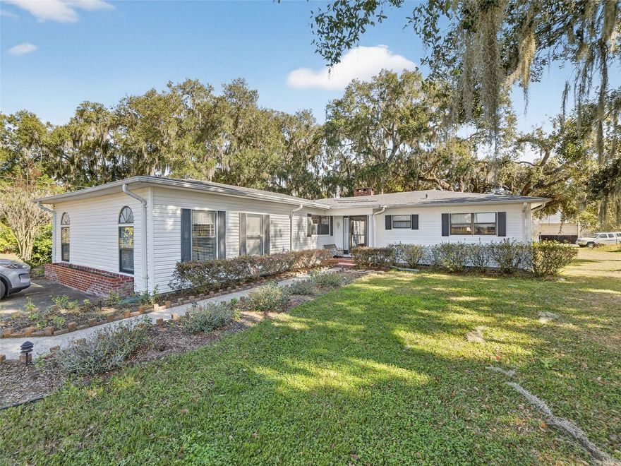 Welcome home to 3802 C.A. Bugg Rd, a beautifully renovated 3-bedroom, 2-bath ranch-style residence offering 2,291 square feet of thoughtfully designed living space on nearly 5 acres of private, usable land in the heart of Plant City. This rare opportunity delivers the ideal balance of peaceful country living and everyday convenience with NO HOA, NO CDD, and NO flood zone—giving you freedom, flexibility, and peace of mind.

From the moment you arrive, the long private setting and towering mature oak trees create a welcoming sense of tranquility. Inside, you’re greeted by a massive open floor plan flooded with natural light from multiple oversized windows that frame serene views of your expansive property. New luxury vinyl plank flooring enhances the oversized living and dining rooms, offering both modern style and durability. The living room is anchored by a wood-burning fireplace with a stone front, providing a cozy gathering space for evenings at home.

The spacious kitchen is designed for both functionality and entertaining, featuring abundant cabinet and counter space, a cooktop, and a built-in oven. The adjoining dinette includes a built-in white cabinet buffet, adding charm, storage, and a perfect spot for serving or display.

A split-bedroom floor plan ensures privacy for all. The generous primary suite serves as a true retreat with two closets, including a walk-in. The secondary bathroom features an updated white vanity with a cultured marble countertop and a tub/shower combo, while the second bath offers a walk-in shower, ideal for guests or multi-generational living.

Practical features abound, including an extra-large laundry room with abundant storage space conveniently located near the garage. The oversized 32’ x 24’ garage provides ample room for vehicles, tools, equipment, or a workshop.

Step outside to enjoy the true highlight of this property—nearly 5 acres of open, private land offering endless possibilities. Relax or entertain on the rear deck, gather under the lighted gazebo, or take advantage of the shed for additional storage. The property is equipped with two wells and two septic systems, offering flexibility and future potential. Nature enthusiasts will delight in regular sightings of owls, hawks, and eagles, making this a peaceful retreat for those who appreciate the outdoors.

With ample space to bring your horses, cattle, RV, and boat, this property supports a wide range of lifestyles—from hobby farming to recreational living. Tucked away from major roads yet just a short drive to Tampa, Orlando, beaches, airports, shopping, and dining, this home truly offers the best of both worlds.

Located in Plant City, proudly known as the Winter Strawberry Capital of the World, you’ll enjoy small-town charm, community events, and the famous annual Strawberry Festival featuring world-class entertainment, local agriculture, and family-friendly attractions.

This is more than a home—it’s a private country sanctuary with modern comfort and unmatched freedom. Schedule your private showing today and experience it for yourself. Roof 2021, AC 2021, Hot Water Heater 2017, Blown Insulation 20212, Water Softener. Multiple hose bibs throughout the property, shed has electrical, electrical timer on gazebo.
