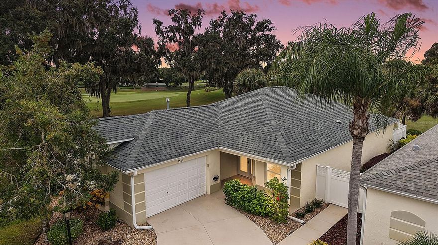 Under contract-accepting backup offers. STUNNING, GOLF FRONT and WATER VIEW, 3/2 BLOCK and STUCCO Grantham Courtyard Villa with screened LANAI and EXTENDED BIRDCAGE on a LARGE, PRIVATE, END-UNIT LOT in the highly sought-after Village of Virginia Trace! - JUST MINUTES to Lake Sumter Landing! TOTAL KITCHEN REMODEL IN LAST YEAR, NEW ROOF (2023) LOW BOND-Only $4,175! LOW-MAINTENANCE, STONED and CONCRETE front, side, and rear yards - NO GRASS! A QUAINT front porch and LEADED GLASS door and side lite welcome you in to this SPECTACULAR home! CROWN MOLDING THROUGHOUT the home, and MODERN fans and lighting set a tone of pure ELEGANCE! THREE SOLAR TUBES also provide AMPLE NATURAL LIGHT. VAULTED ceilings and the OPEN CONCEPT floor plan of the living, dining, and kitchen create a SPACIOUS main area boasting HARDWOOD flooring and OVERLOOKING FABULOUS GOLF and WATER VIEWS! The AMAZING kitchen is a chef’s delight boasting GORGEOUS, STAGGERED, ALABASTER cabinetry with GLAZED edging and PULL-OUTS; VEINED QUARTZ countertops; GLASS-TILE backsplash, BLACK STAINLESS CAFE appliances; built-in DOUBLE PANTRY; under-cabinet LIGHTING; and a u-shaped EXPANSIVE CENTER ISLAND with EAT-IN breakfast bar. From the living room, step through sliding glass doors, into a SPACIOUS screened LANAI with an EXTENDED BIRDCAGE. This FANTASTIC outdoor area offers a TRANQUIL, PRIVATE space to relax with your morning coffee, evening cocktail, a good book, or simply enjoy the INCREDIBLE GOLF and WATER VIEWS! Back inside, retreat to the primary bedroom boasting  RICH, WARM HARDWOOD flooring; VAULTED ceiling; SPACIOUS, CUSTOM, WALK-IN closet; and SLIDING GLASS DOORS to the ENCLOSED lanai. It’s en-suite bathroom features WHITE cabinetry with GRANITE countertop and a TILED WALK-IN shower. Bedroom two showcases RICH, WARM HARDWOOD floors, VAULTED CEILING, CUSTOM MURPHY BED and cabinetry, and a built-in closet. The second bathroom features a WHITE vanity, with GRANITE top, TILED tub and shower combination, and a hallway LINEN closet. The third bedroom offers RICH, WARM HARDWOOD flooring, VAULTED ceiling, and a CUSTOM built-in closet. An INTERIOR laundry room boasts ALABASTER cabinetry with GLAZED edging and VEINED QUARTZ counters, a built-in UTILITY SINK, and an all-in-one GE Profile washer and dryer. Completing the package is a 23’x18’ one and a half  car garage with attic-access stairs, a PURONICS water filtration system, and a WOLF electric car charger. DON’T MISS YOUR OPPORTUNITY TO MAKE THIS INCREDIBLE HOME YOUR OWN! The Village of Virginia Trace offers an UNBEATABLE LOCATION - JUST MINUTES to Lake Sumter Landing - where you’ll find an array of shopping, dining, and live nightly entertainment! You’ll also be close to Mallory Hill and Arnold Palmer Country Clubs and Championship Golf Courses. Health enthusiasts will love the proximity to the Lake Miona Regional Recreation Center and Fitness Trail. This home is truly a gem, located in one of the most desirable neighborhoods in The Villages! PLEASE WATCH OUR WALKTHROUGH VIDEO of this GORGEOUS GOLF and WATER VIEW HOME in an INCREDIBLE LOCATION and call today to schedule your Private Showing or Virtual Tour!