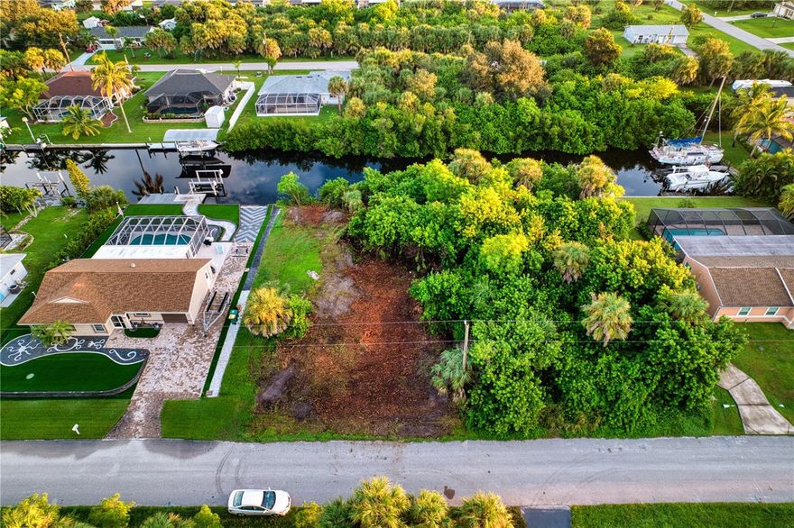 Rare Waterfront Residential Lot Opportunity in Sunny Port Charlotte! 

This prime, buildable lot offers direct access to the Bay and Gulf with sailboat-depth water and no fixed bridges—a boater’s dream! Nestled in a quiet tropical setting, the property has already been partially cleared, making it easy to start planning your Florida waterfront retreat. Imagine stepping out your back door, hopping on your boat, and cruising the turquoise waters of Charlotte Harbor in minutes.

Surrounded by lush tropical landscape, year-round sunshine, and a community known for fishing, boating, and relaxed coastal living, this property is the perfect place to build your forever home, seasonal getaway, or a highly sought after rental. New construction is booming in this area, so secure your piece of paradise while you can.

Conveniently located near world-class beaches, golf, dining, and shopping. 

 Don’t miss this rare chance to own a true waterfront gem with unrestricted boating access!