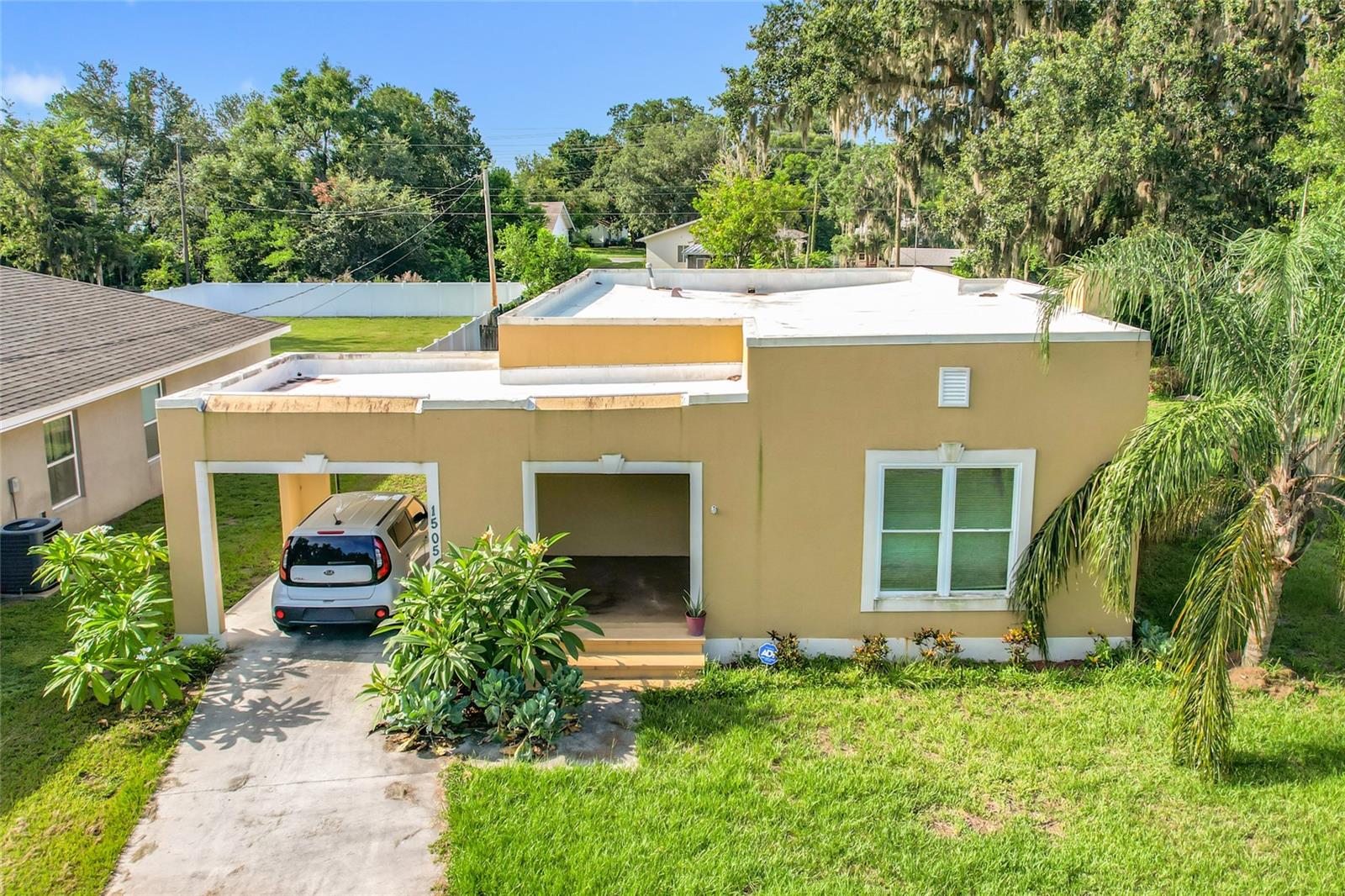 Short Sale. SHORT SALE – PRICE NOT YET APPROVED BY LENDER. This charming 2-bedroom Spanish-style bungalow is located in the established Shore Acres community of Lakeland, just moments from Lake Bonny, Lake Parker, and the Lake-to-Lake Bikeway. Featuring an oversized, fenced lot with mature shade trees and no HOA or CDD, it’s an excellent opportunity for first-time buyers or investors looking to build equity and unlock future value. Originally renovated in 2018, the home blends vintage character with modern upgrades, including stainless steel appliances, updated kitchen cabinetry, a dual-sink bathroom with custom tile, French doors leading to the spacious backyard, and modern vinyl and laminate flooring throughout. The living room showcases arched doorways, crown molding, and a decorative fireplace ready for an electric insert. The dining room offers flexibility as a home office or den, and the backyard provides plenty of room for entertaining, gardening, or potential expansion. Additional features include a dedicated laundry area, carport with ceiling fan, newer fixtures, and off-street parking. With close proximity to local colleges, Polk Parkway, I-4, and downtown Lakeland—and just under an hour to Walt Disney World and 90 minutes to the Gulf beaches—this home delivers on flexibility, location, and potential. Zoned RA-3 and located in Flood Zone X, the property uses public utilities and sits on approximately 0.30 acres. Buyer to verify all information. Home is sold as-is. Sale is subject to lender approval.