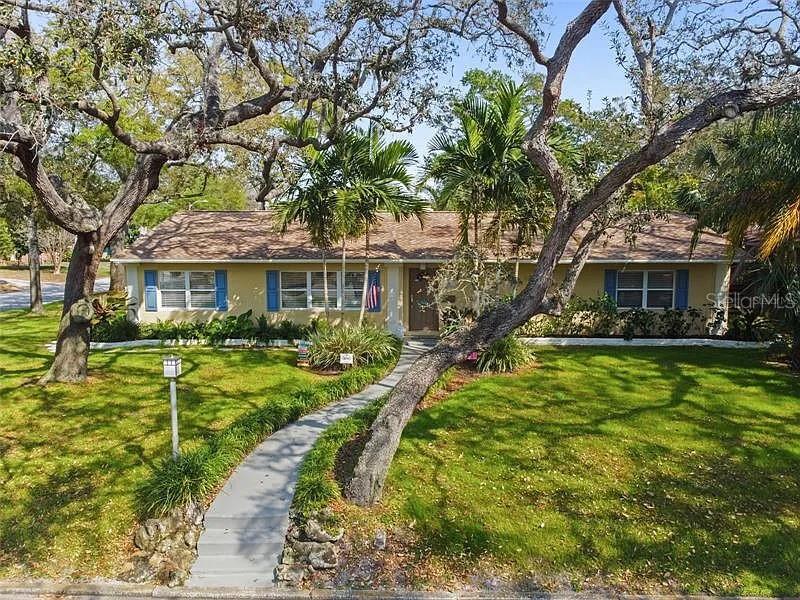 One or more photo(s) has been virtually staged. One or more photo(s) was virtually staged. Welcome to this inviting St. Petersburg retreat set on a spacious corner lot of almost ¼ acre, offering the perfect mix of classic character and relaxed Florida living. This 3-bedroom, 2-bath home features generous living spaces, a functional layout, and plenty of room to entertain both inside and out.
The heart of the home flows from a bright living and dining area into a well-appointed kitchen, while a large, enclosed Florida room extends the living space and creates the ideal spot for gatherings, hobbies, or simply unwinding by the fireplace.
Step outside and discover your own private escape: a sparkling oversized pool, outdoor shower, and lush landscaping with a well for irrigation, all of which provides a true backyard oasis. With plenty of covered seating and room for outdoor dining, this space was designed for year-round enjoyment.
Practical features include a two-car garage, an indoor laundry room with washer and dryer, additional storage, and and outdoor/pool bathroom. The home sits on high ground and is just minutes from downtown St. Pete, vibrant local shops, and the Gulf beaches, making it both convenient and tucked away.
If you’re looking for a property with timeless charm, incredible outdoor living, and a location that puts you in the center of everything, this is the one to see! Call for a private showing and make this home Yours Today!