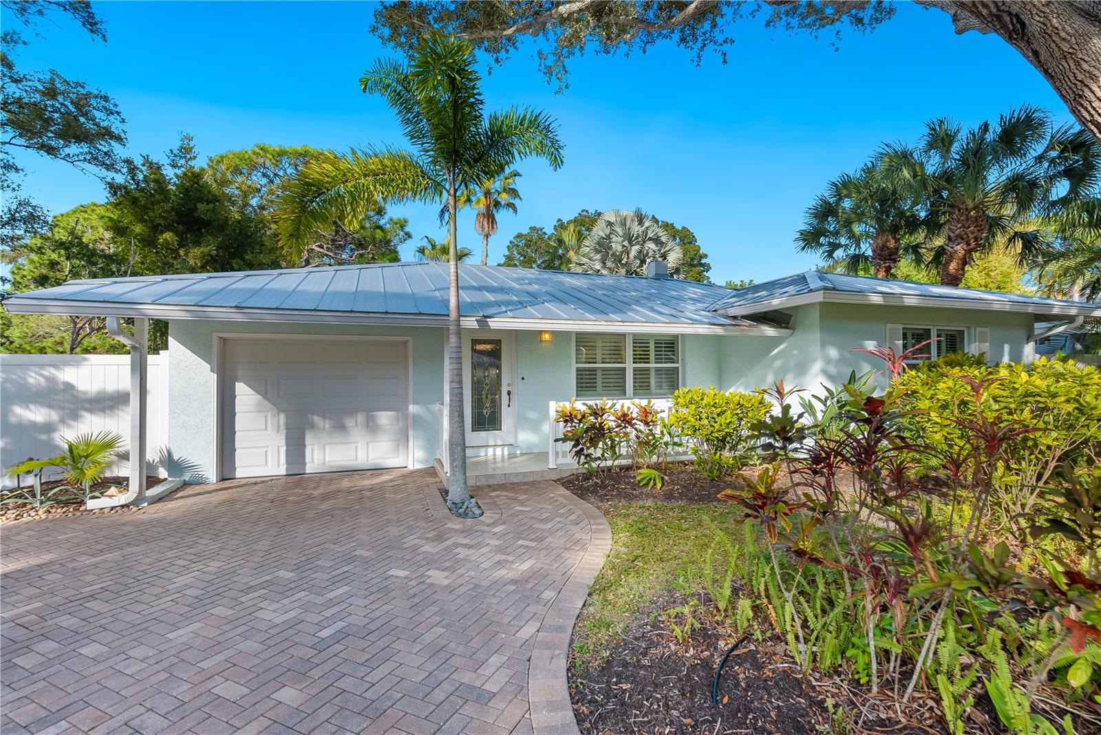 Classic elegance right in the heart of Arlington Park. This bright, newly renovated two-bedroom, two-bath mid-century gem with sparkling pool offers a serene escape, providing a refreshing interplay of historical charm and modern luxury. Enjoy the separate sunroom/office for those working from home. Take a break with a dip in the sparkling pool or a game of bocce ball in the backyard. Walk to Southside Village, Arlington Park pool/tennis/basketball/rec/playground, minutes from downtown and the bay. Boat parking available. Extras, the house comes equipped with high-speed Wi-Fi, central air conditioning, a smart TV for entertainment, and all essentials to ensure a comfortable stay. Laundry is indoors! Location directly between Arlington Park and Southside Village, this place offers a genuine feel of Sarasota's vibrant community spirit. The house is not only close to the park's recreational activities, but also strategically close to Sarasota's bustling arts scene, gourmet restaurants and pristine beaches.
